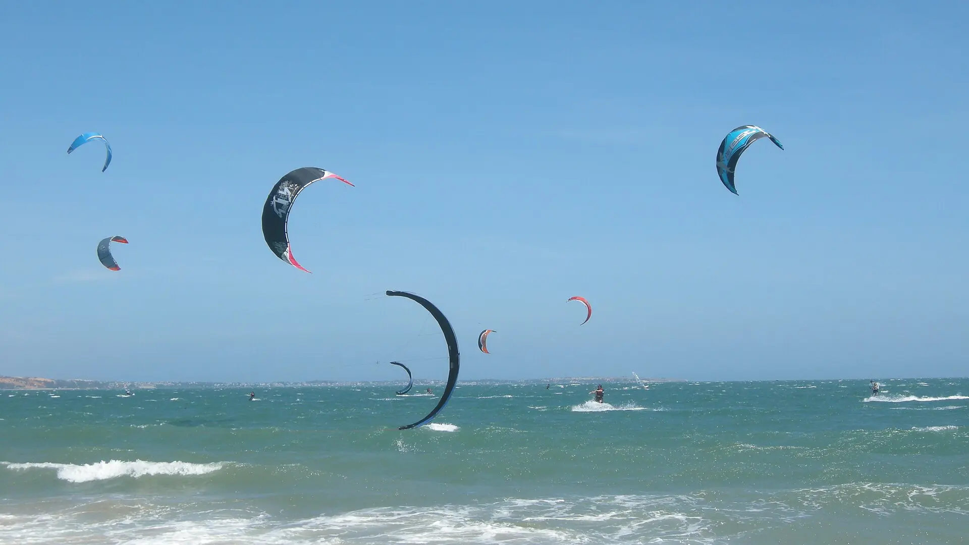 Colourful kites above Mui Ne coastal water