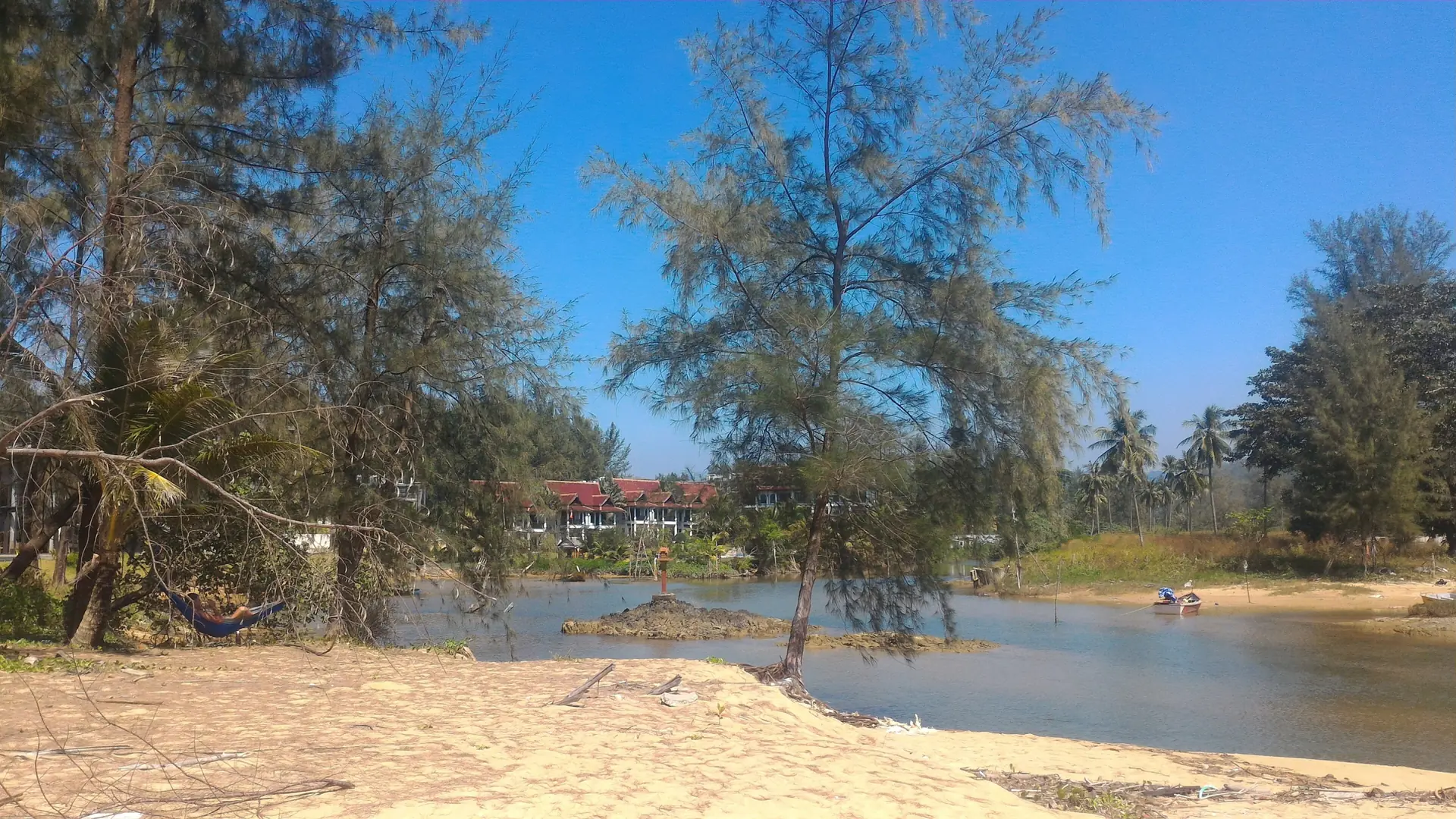Sunlit Khlong Bang Niang estuary near La Vela in wider Khao Lak, rather than Nang Thong
