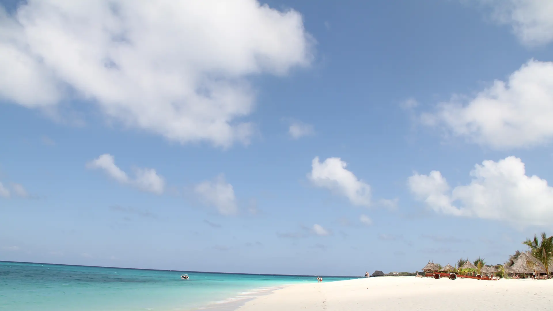 Sunlit white sand and blue sea at Kendwa Beach
