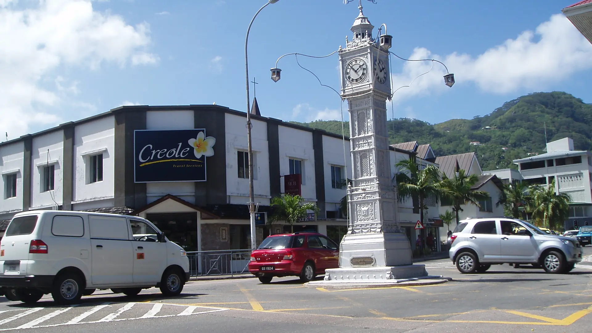 The Victoria Clock Tower and city street on a bright day in Mahé