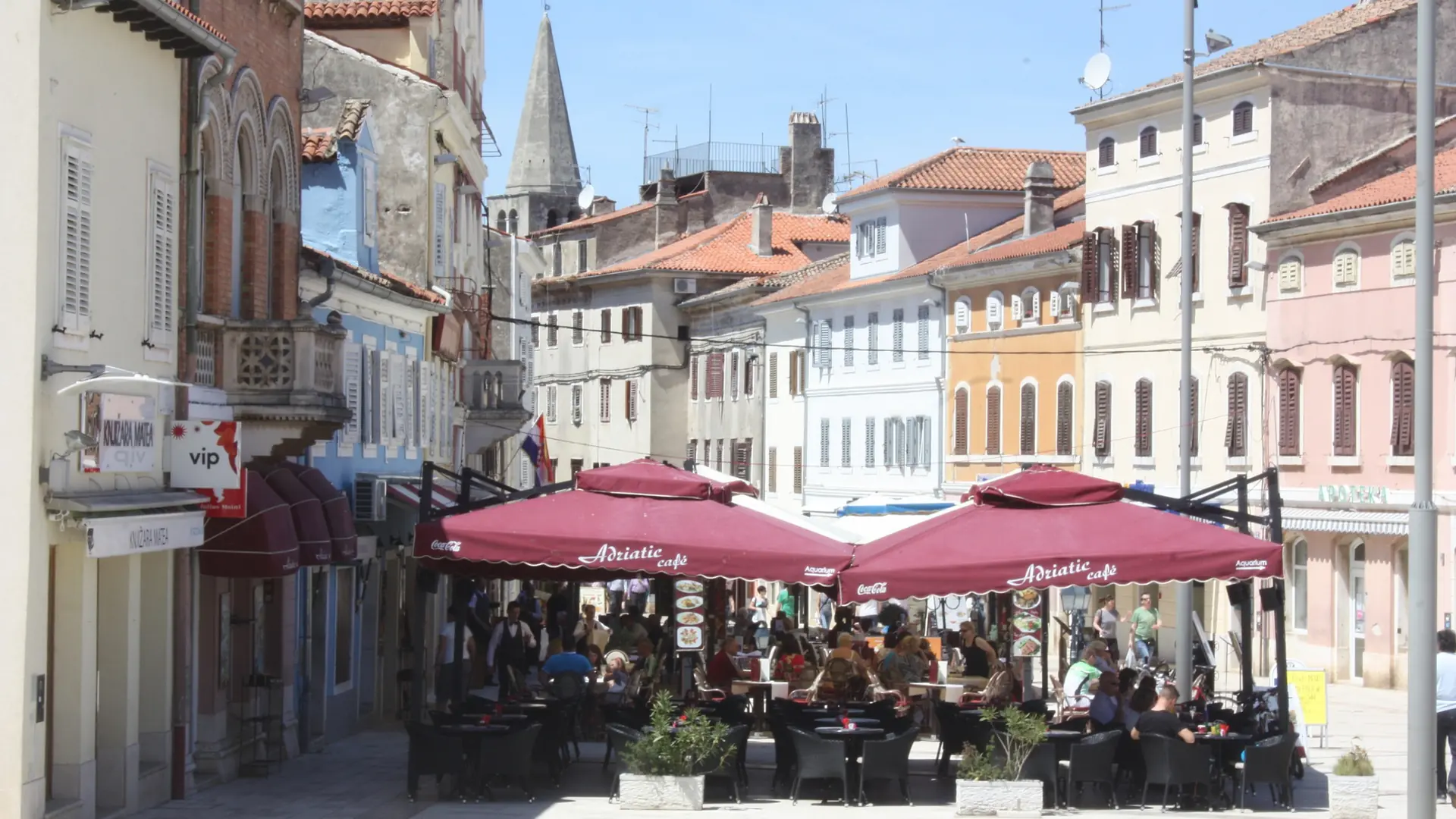 Café terraces and historic façades on the eastern part of Decumanus in Poreč