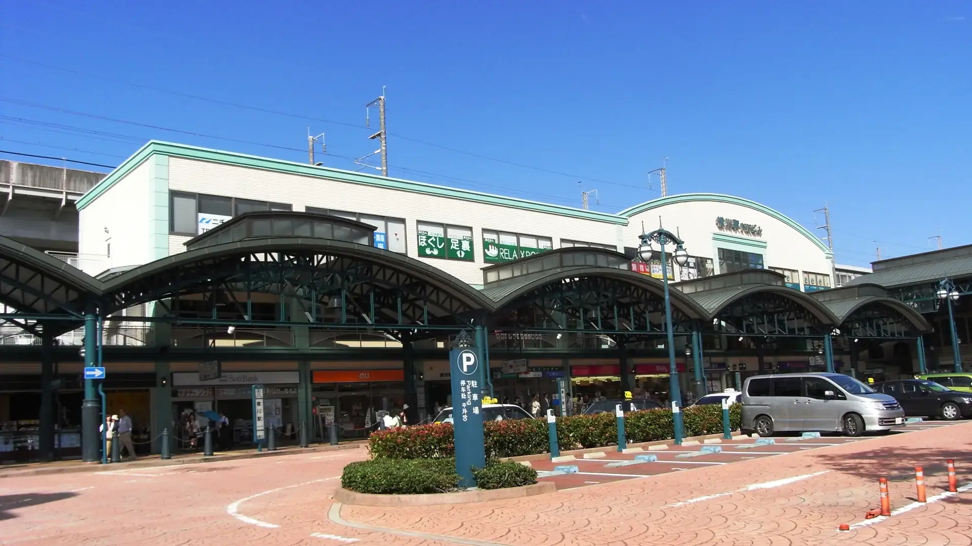 Yokogawa tram stop and neighbourhood streets under a blue Hiroshima sky