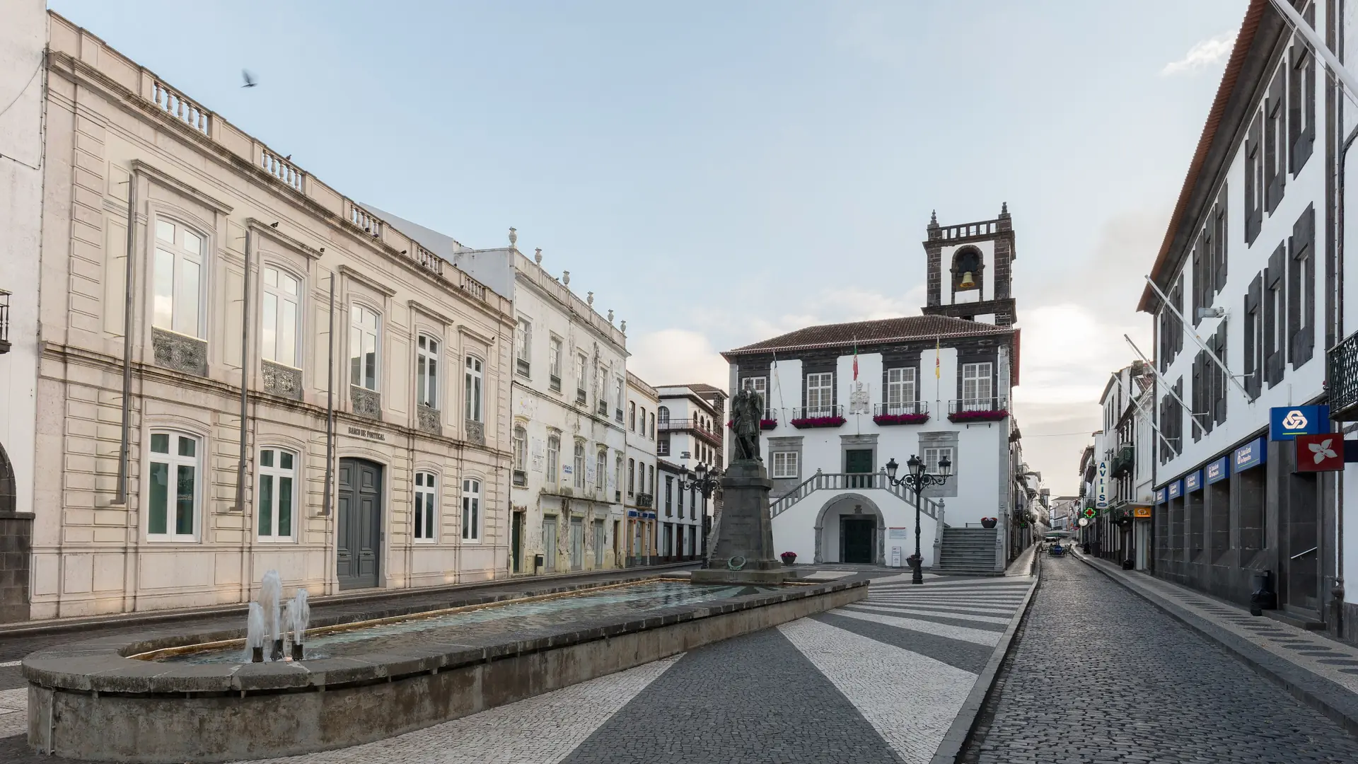 Ponta Delgada's City Hall square with its black basalt clock tower and black-and-white pavement