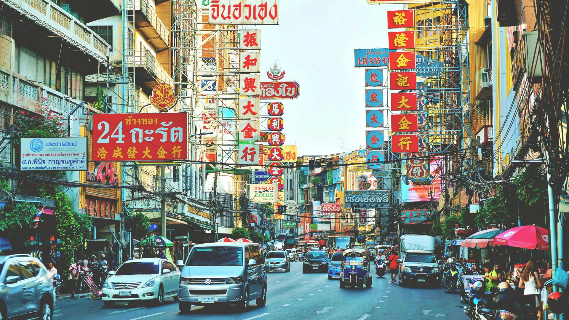 Crowds, shop signs and street traffic filling Bangkok's Chinatown