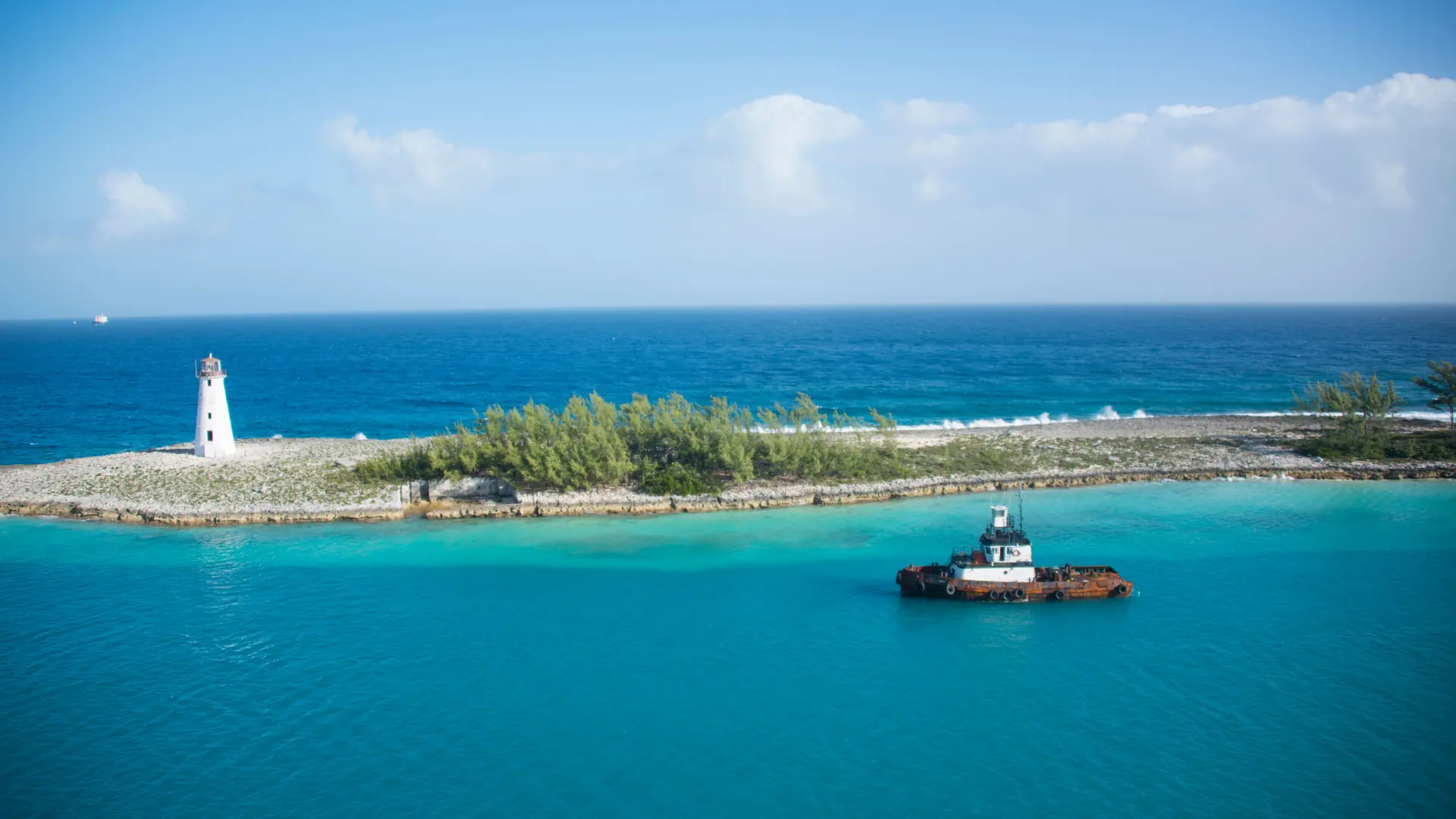 The lighthouse at Nassau Harbour’s entrance, shown as a wider Nassau view