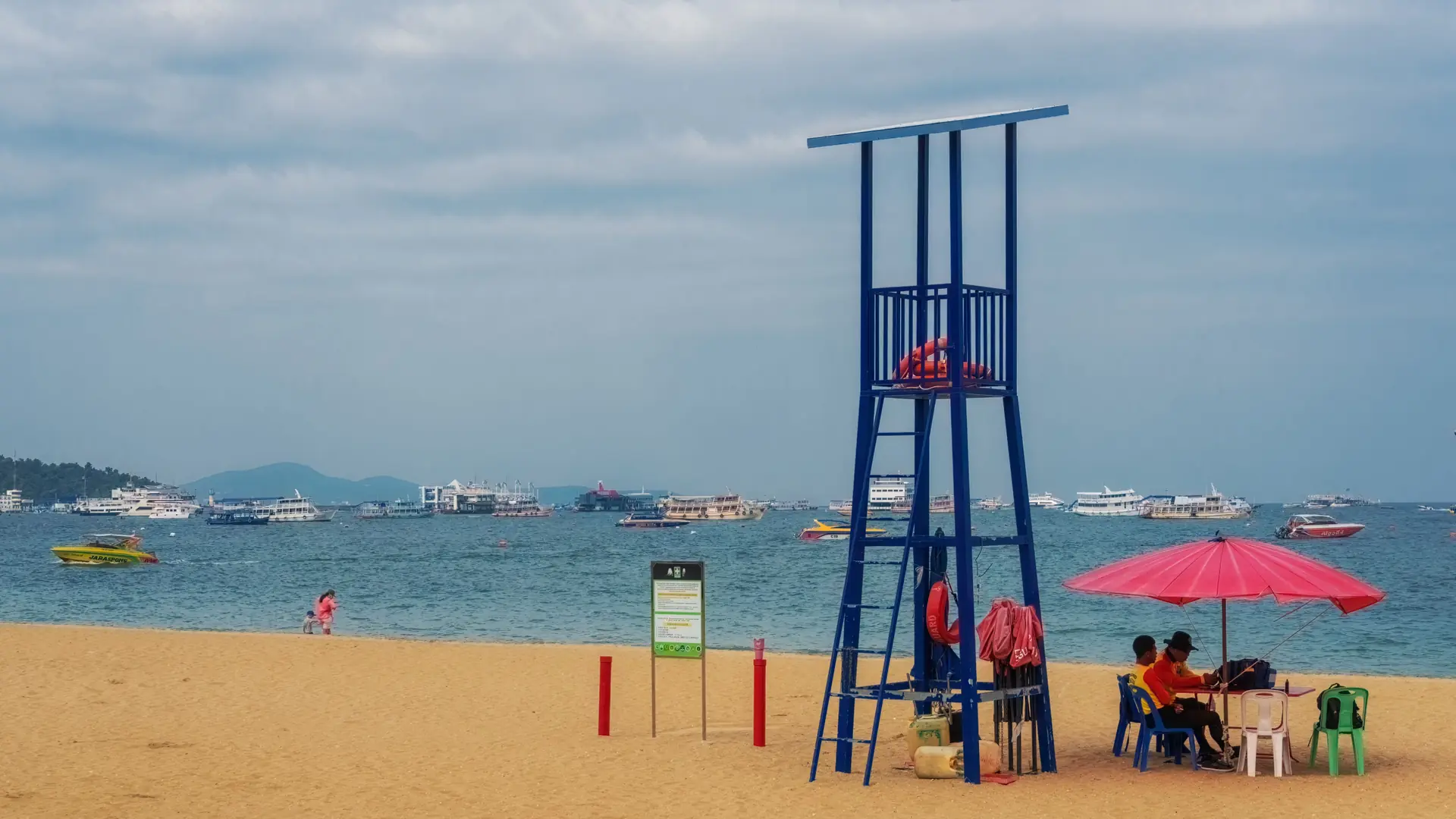 Sun loungers and palms along Pattaya's bright northern beachfront
