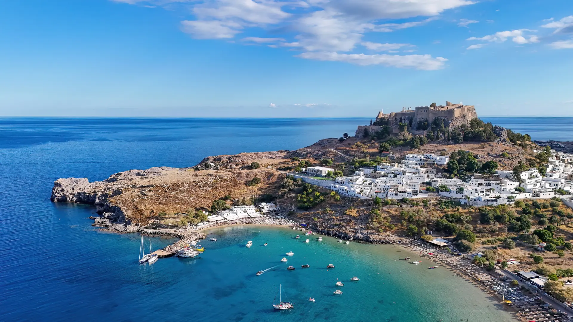 Lindos Acropolis above its white village and turquoise bay on Rhodes