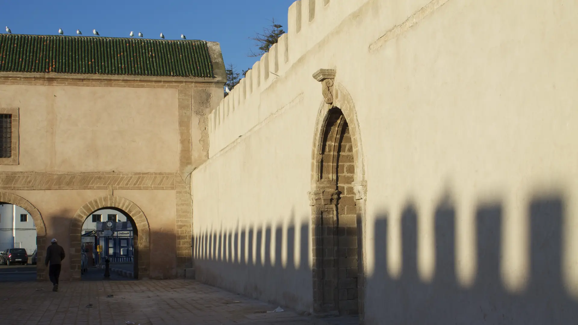 Stone medina wall and side gate in Essaouira in clear daylight