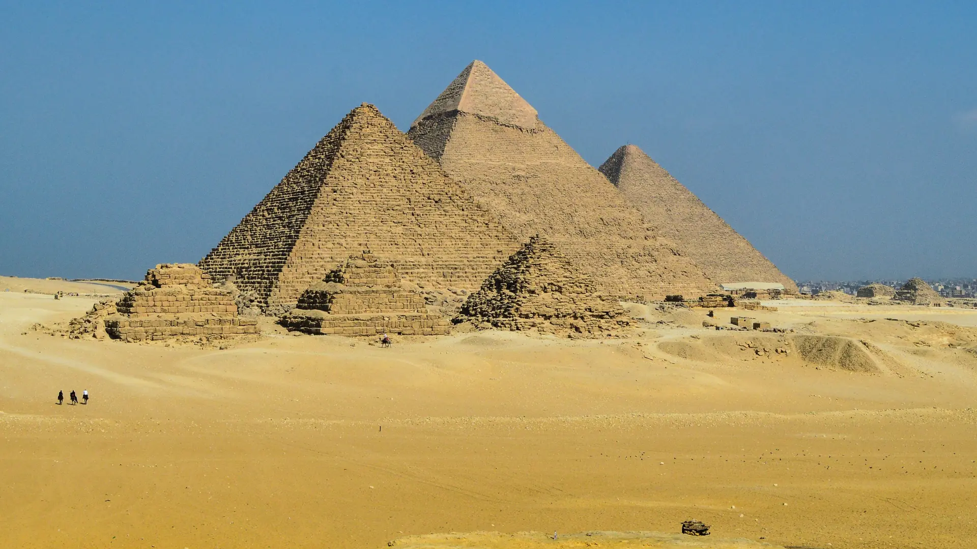The three main pyramids rising from the Giza Plateau in clear daylight