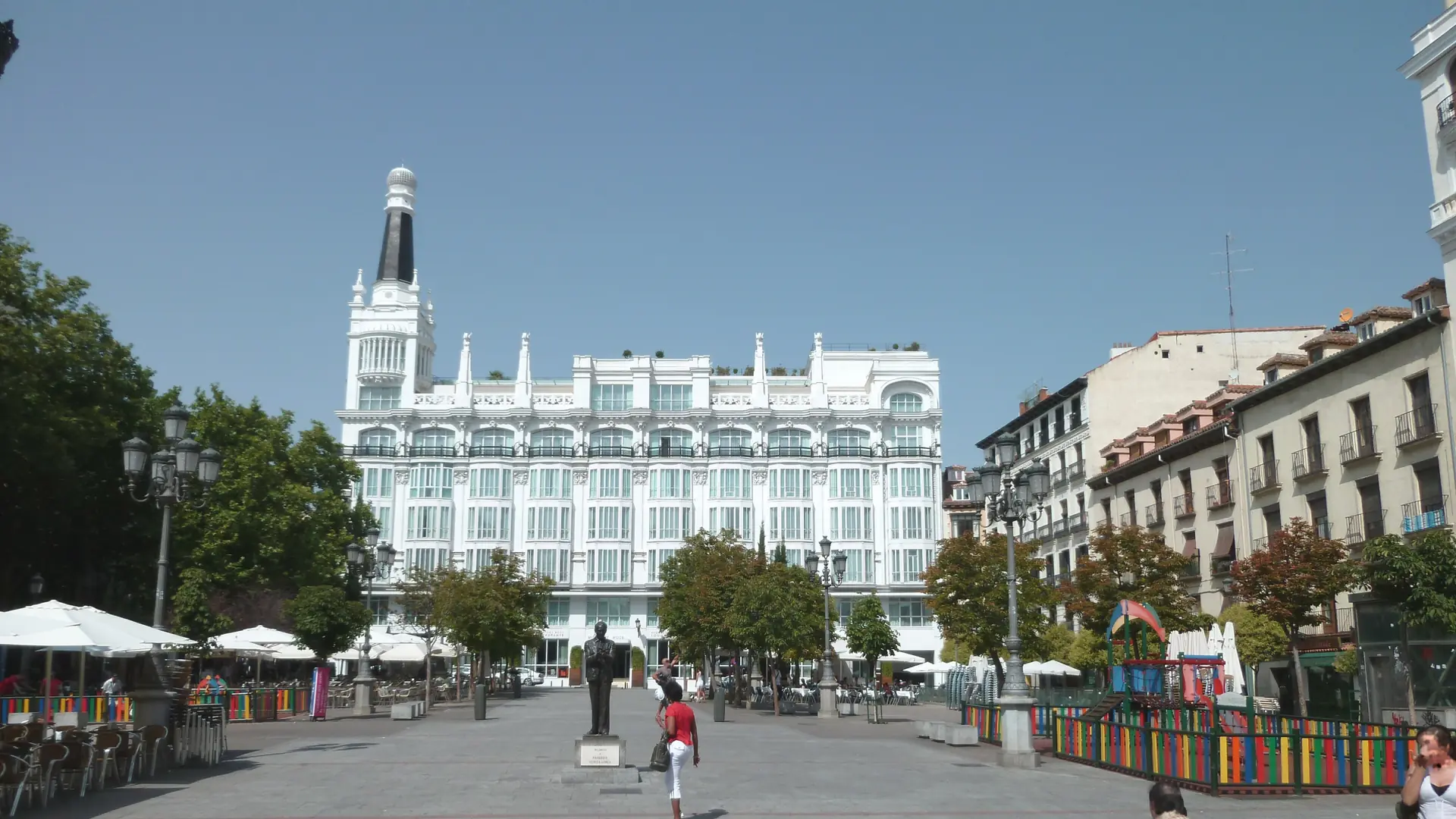 Plaza de Santa Ana in Madrid’s Las Letras district, with the white Reina Victoria facade and café terraces