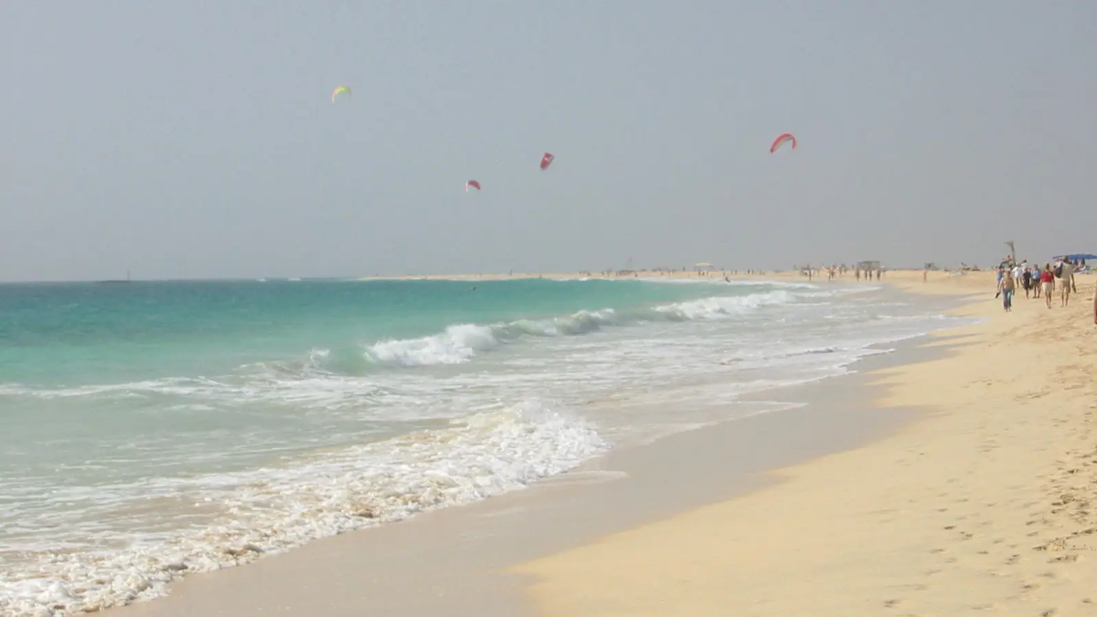 Kites above a pale stretch of Santa Maria Beach on Sal