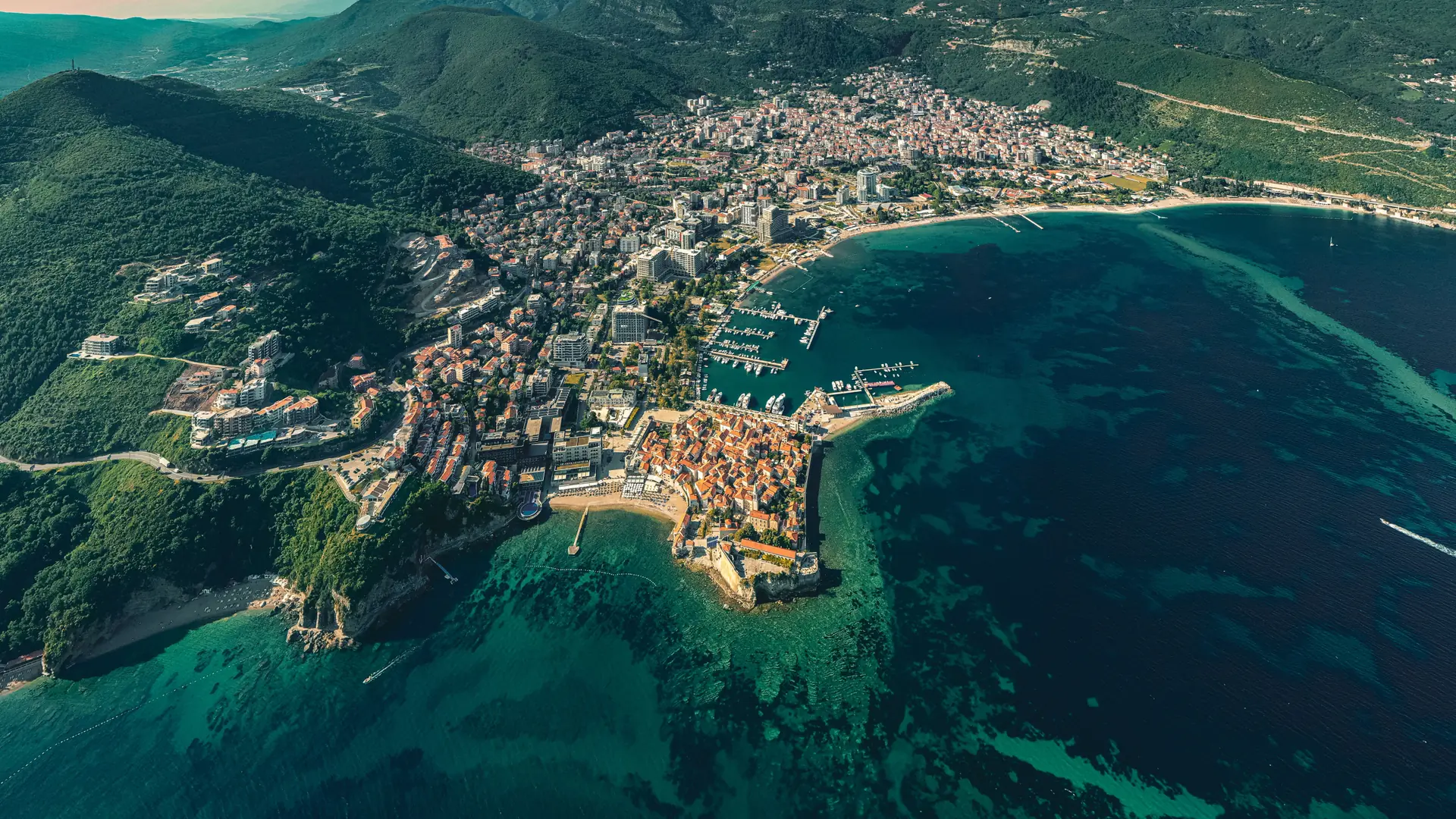 Budva Old Town and marina beside the Adriatic coastline, viewed from above