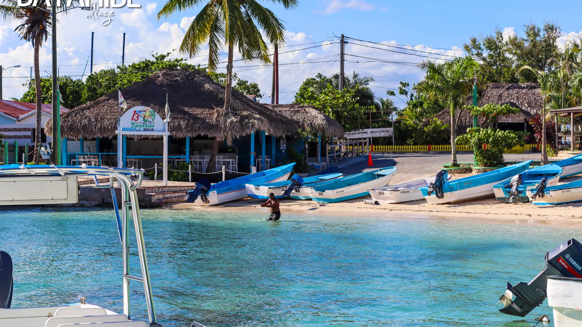 Sunlit boats and waterfront at Bayahíbe village