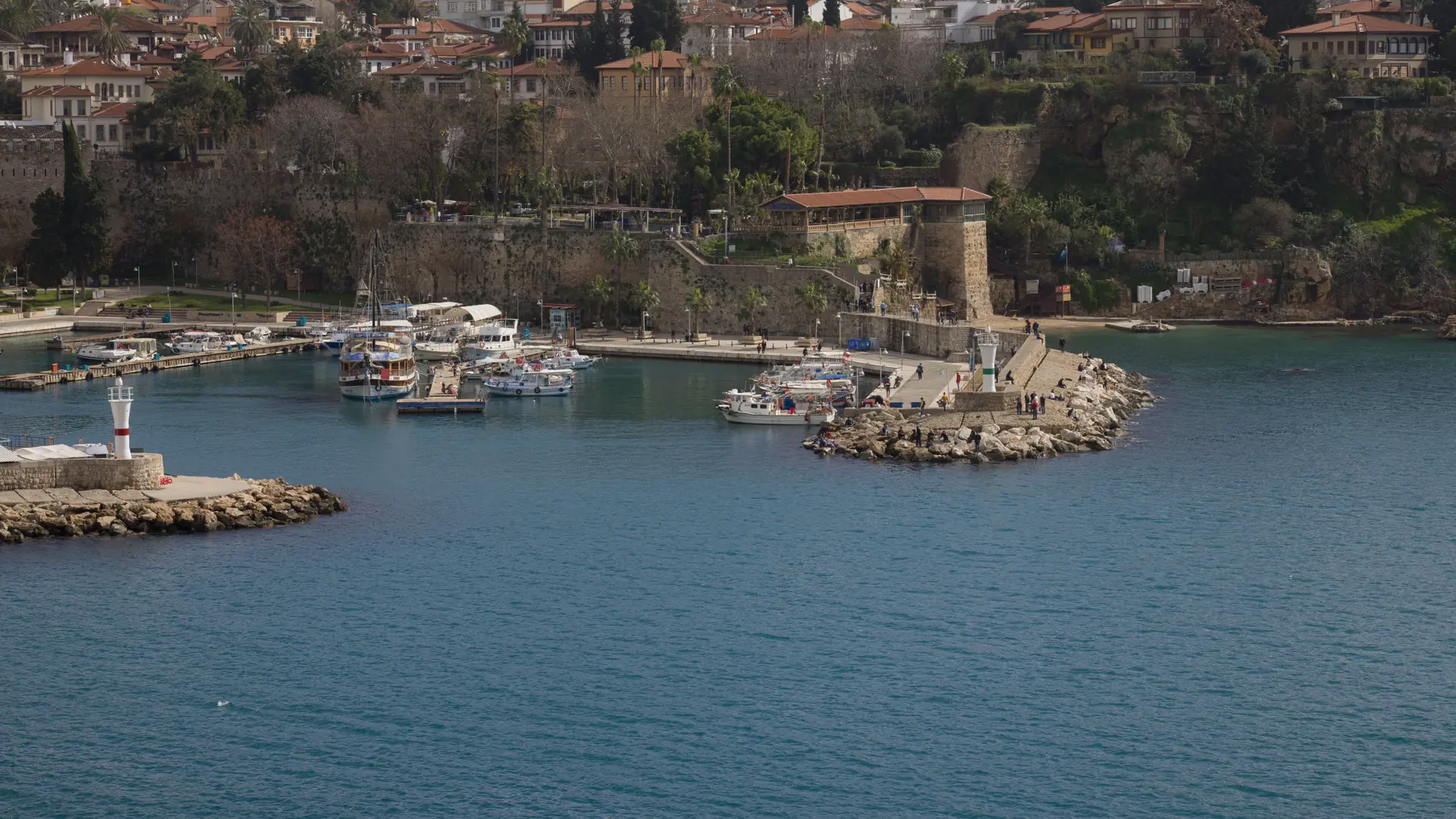 Boats and lighthouse in a sheltered Antalya marina