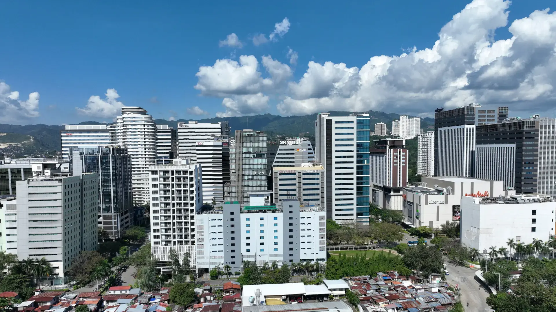 Office towers of Cebu IT Park in Lahug under a blue sky with white clouds