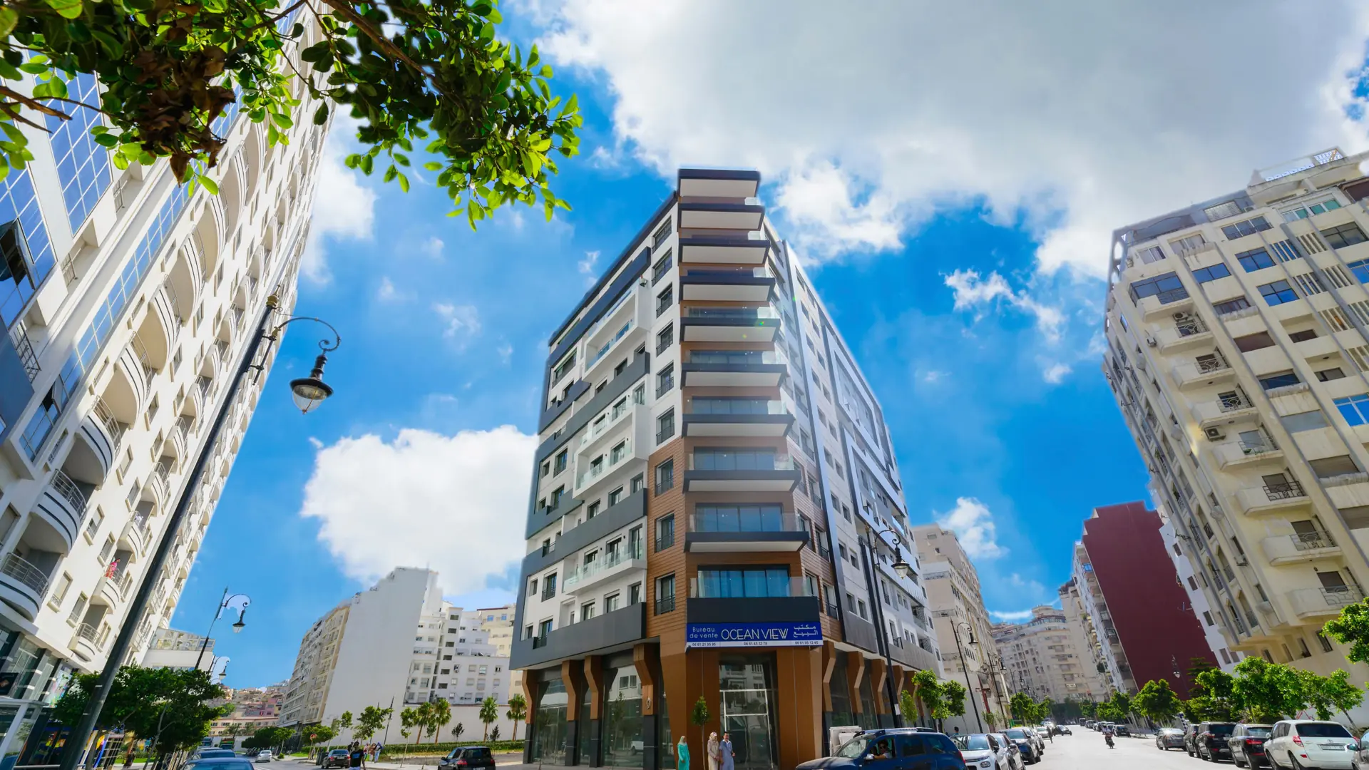 Modern Tangier city buildings beneath a vivid blue sky