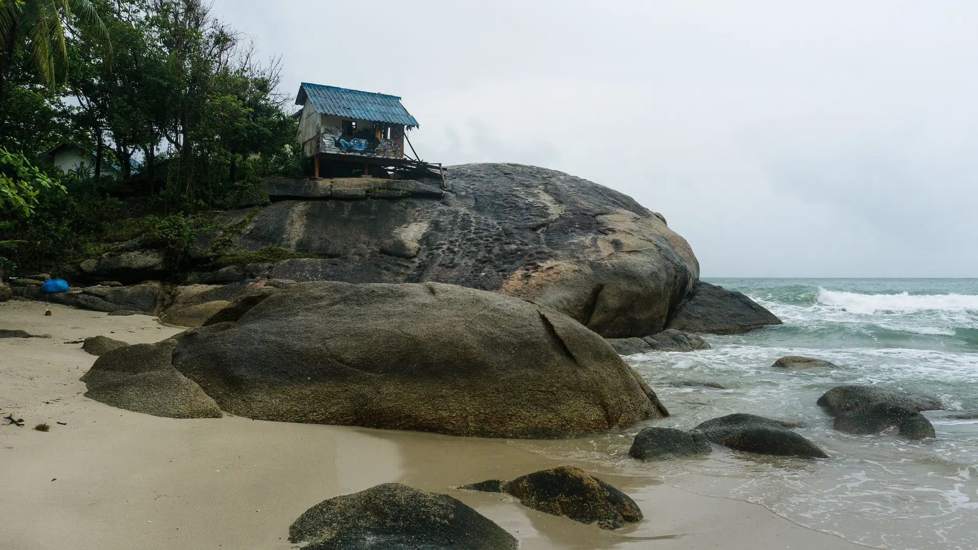 Fishing boats and a green mountain backdrop at northern Koh Phangan