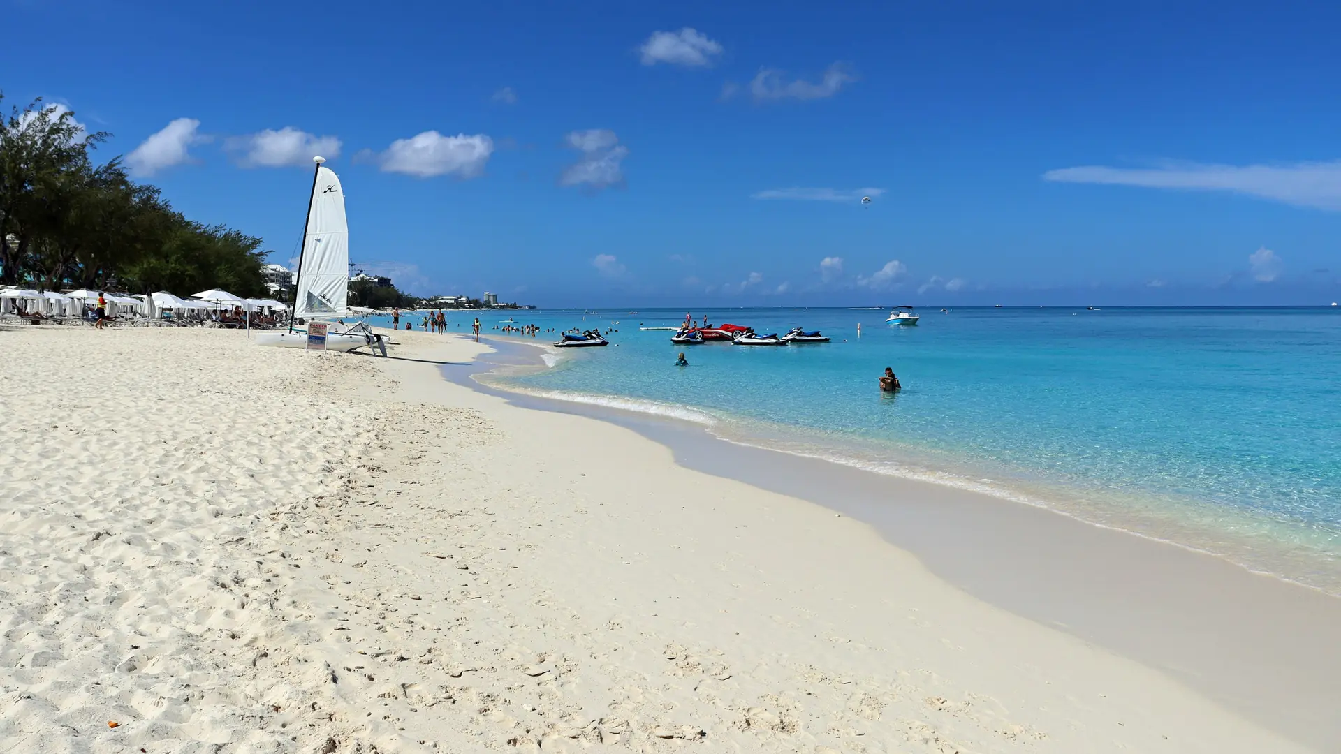 A sailboat beside the sand on southern Seven Mile Beach, Grand Cayman