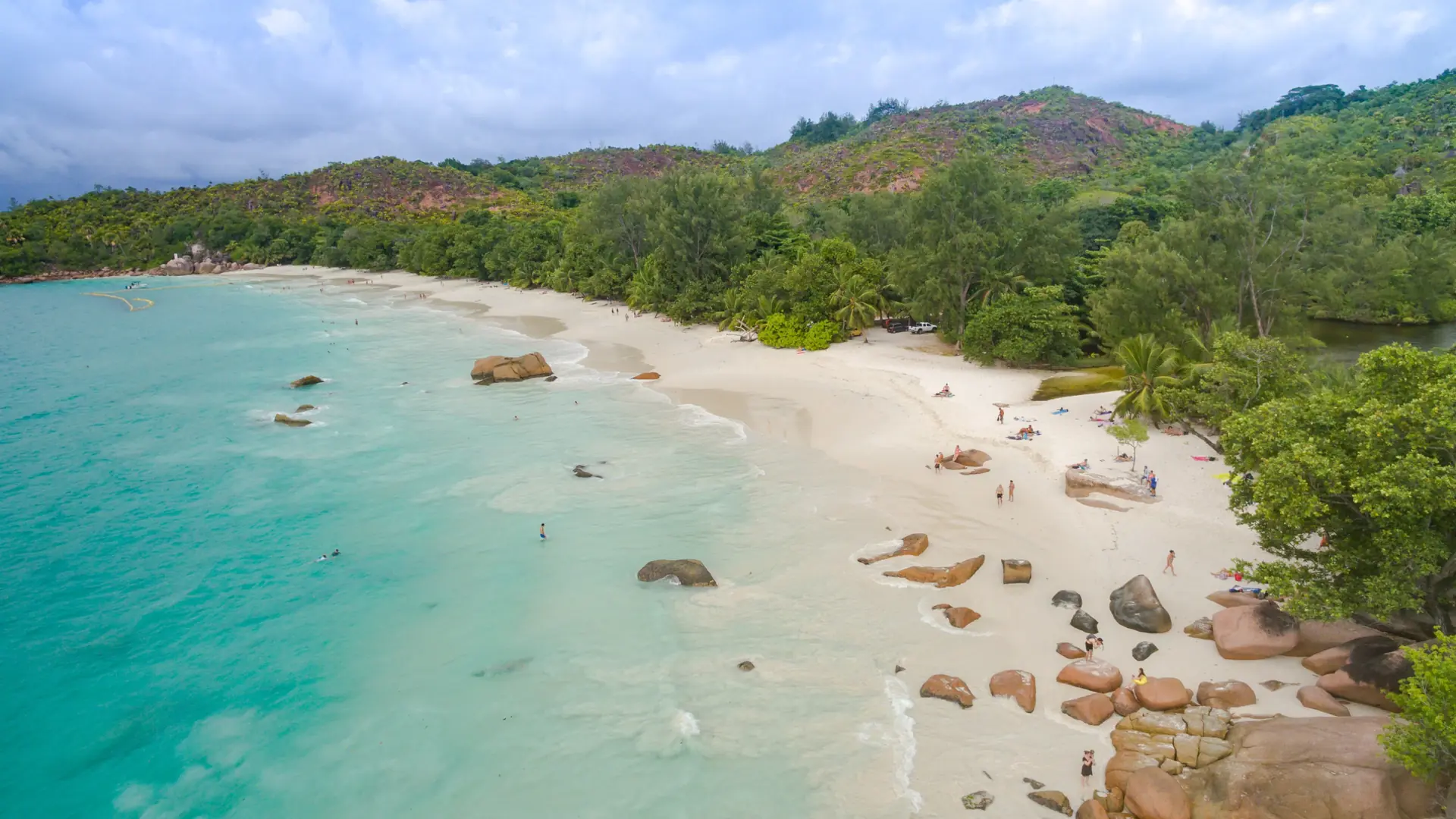 Aerial view of pale sand and turquoise shallows at Anse Lazio on Praslin