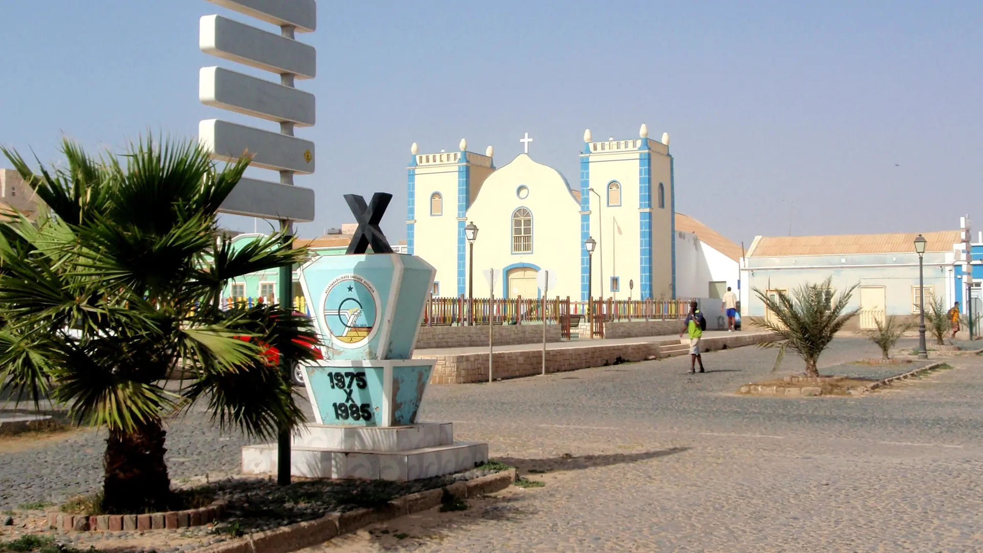 Sunlit church and palm-lined square in Sal Rei on Boa Vista