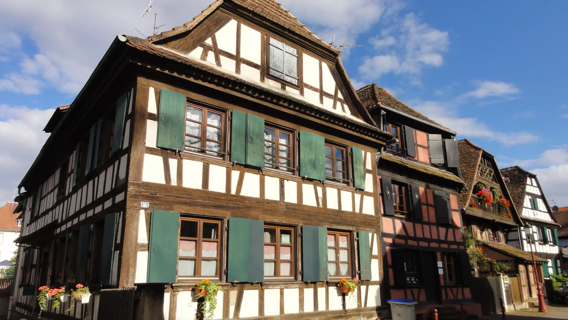 Half-timbered houses with green shutters on rue Principale in Schiltigheim