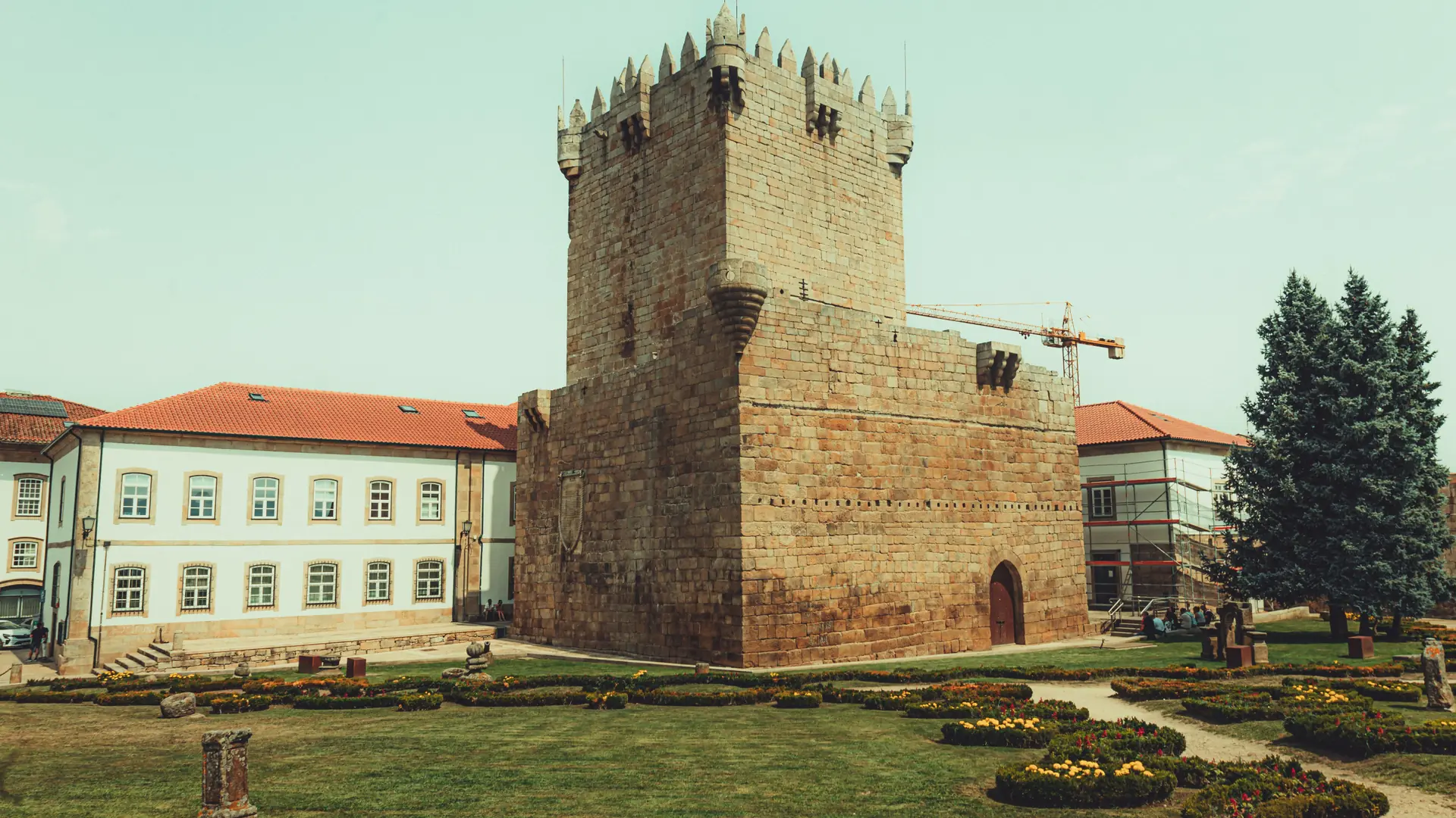 Medieval stone keep standing in a green central Braga garden