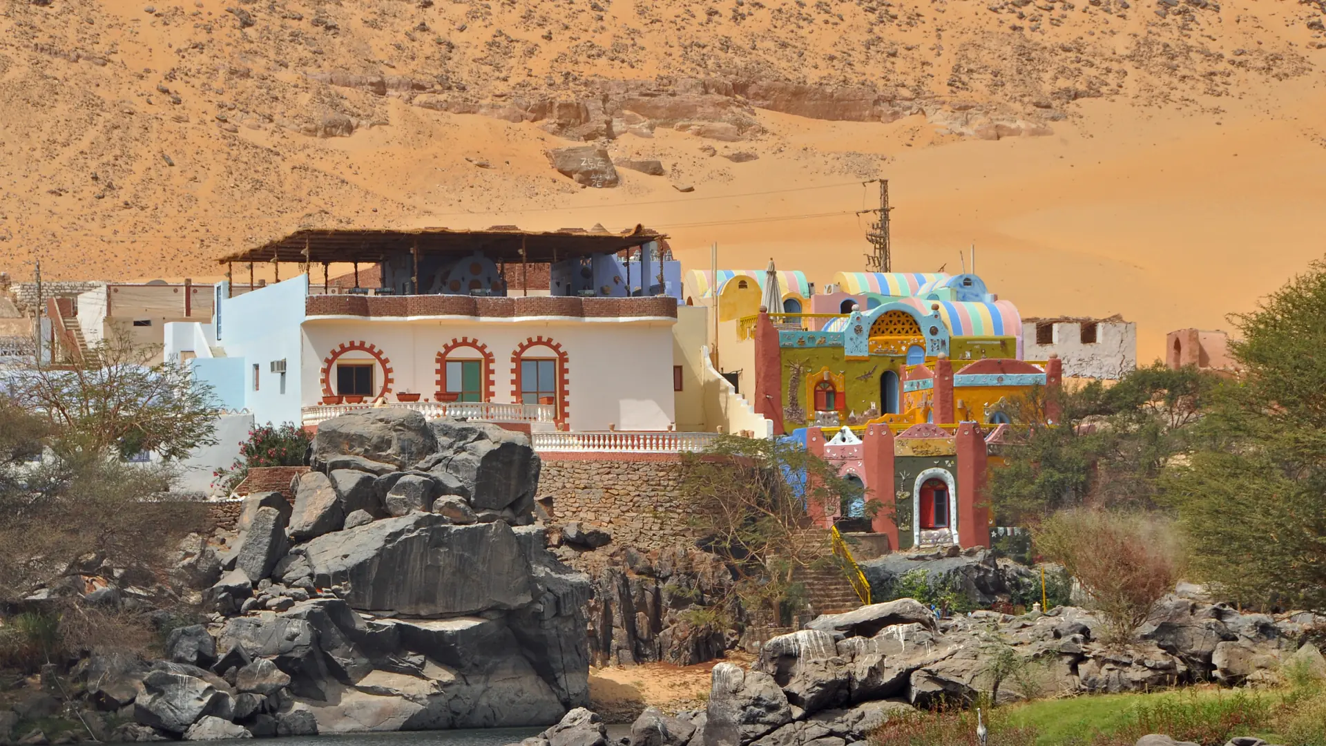 Colourful riverside buildings in Gharb Soheil south of Aswan