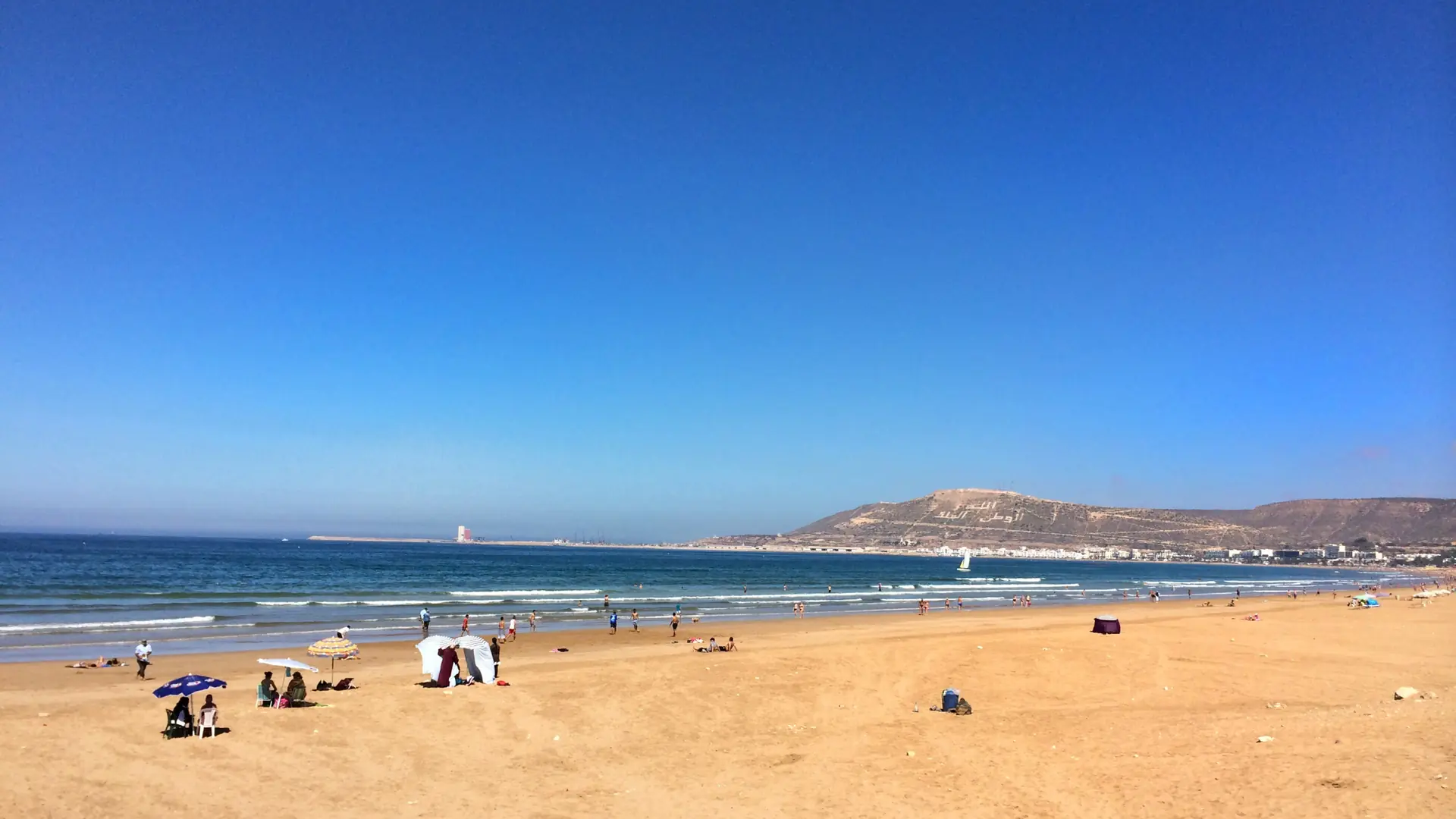 Wide sandy Agadir bay and promenade in bright Atlantic daylight