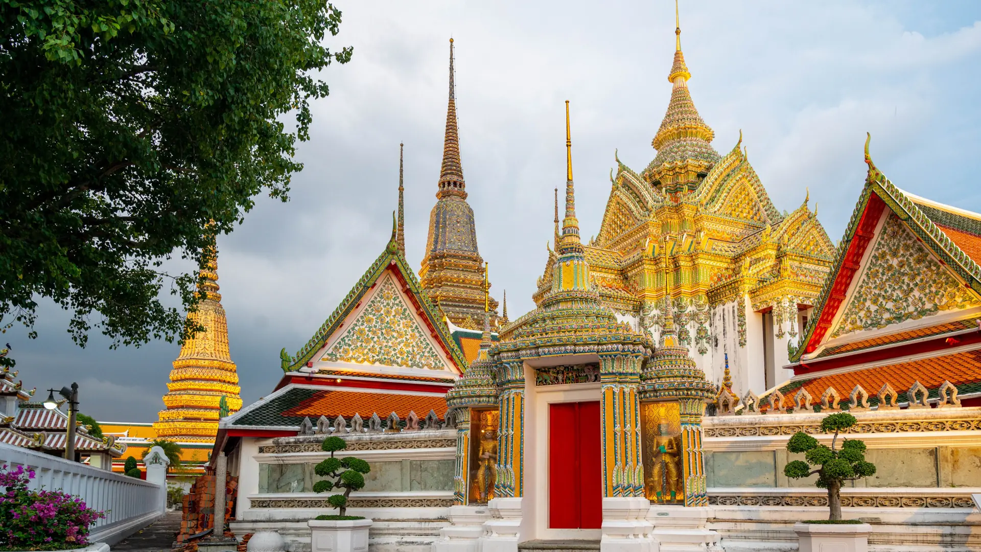 Colourful roofs and tiled stupas inside Bangkok's Wat Pho complex