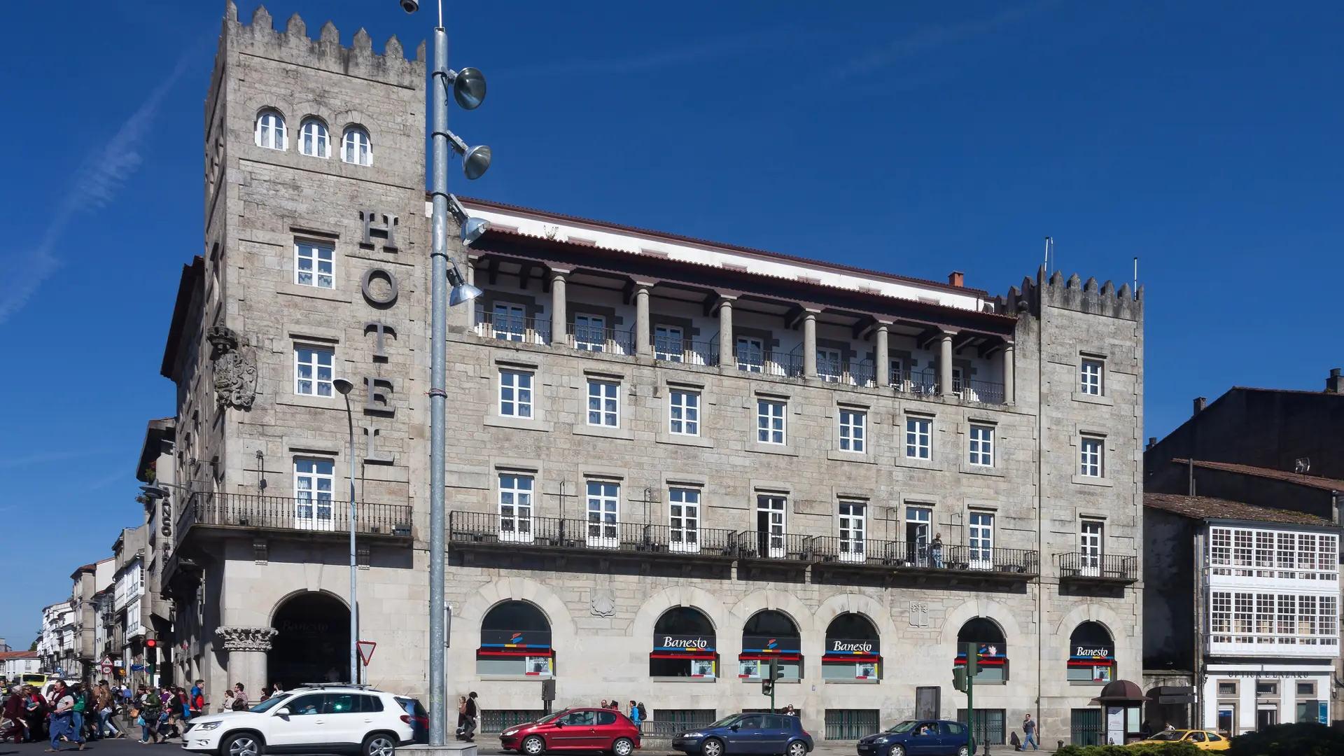 Hotel Compostela’s stone façade at Praza de Galicia in daylight