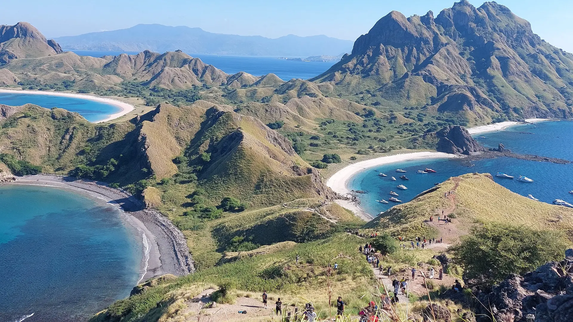 Padar Island’s steep ridges and curved beaches above the blue sea