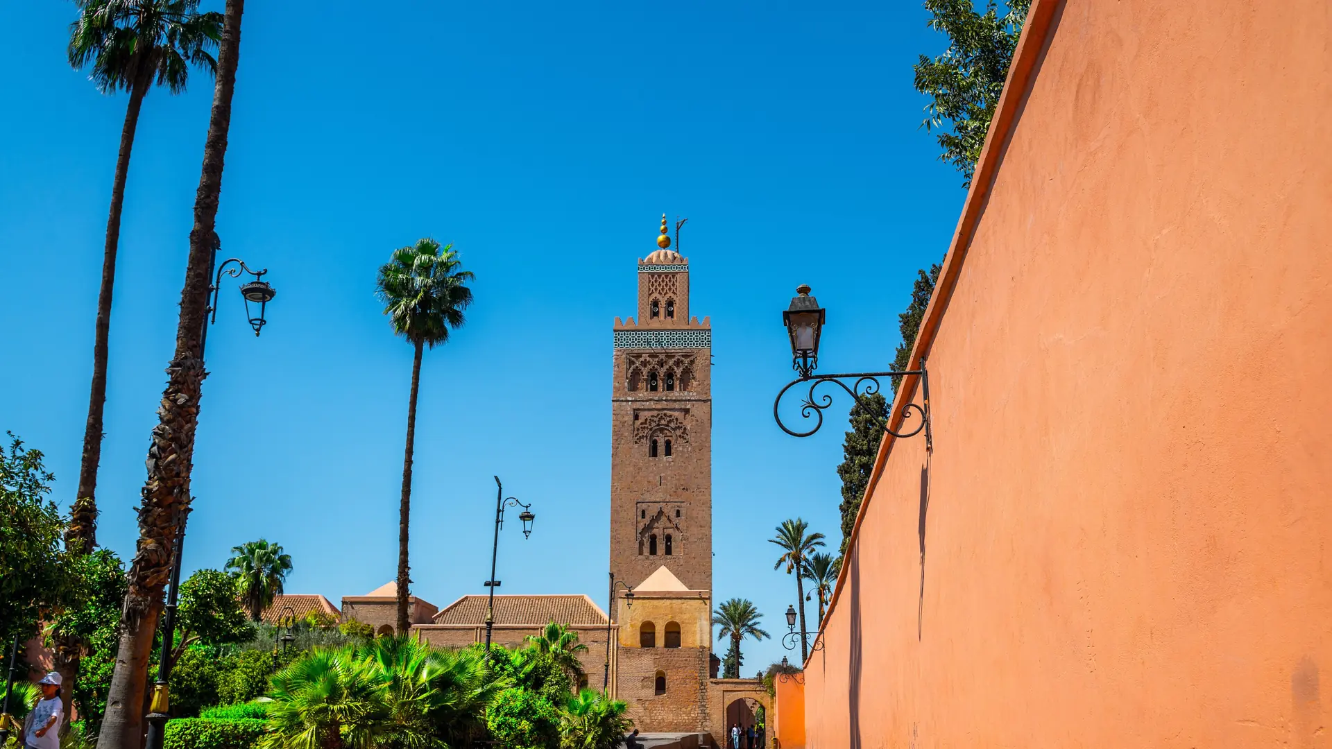 Koutoubia minaret and ochre Marrakech walls in clear daylight