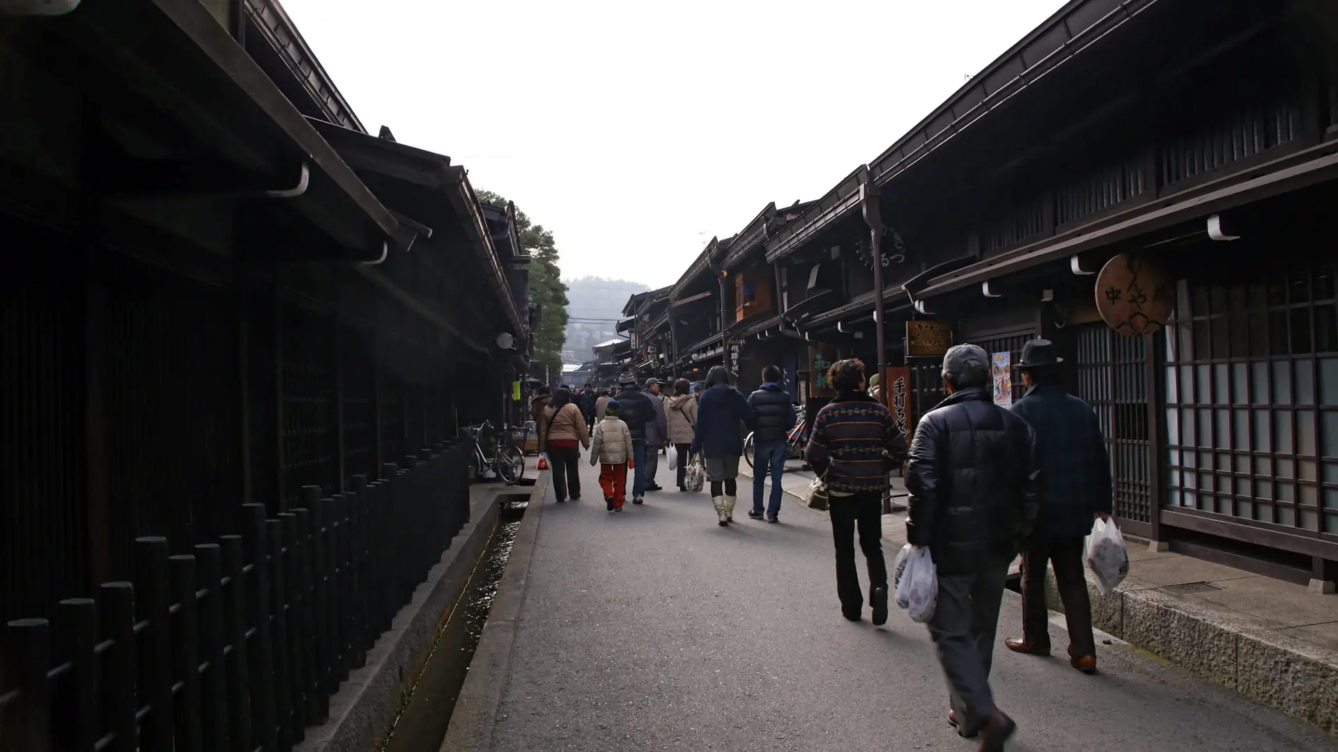 Dark timber merchant houses lining Takayama old town