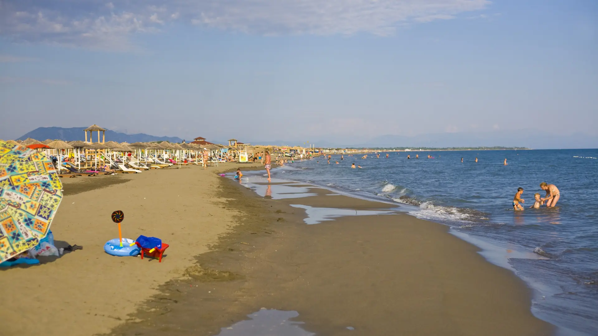 Broad sand and shallow blue water along Velika Plaža near Ulcinj