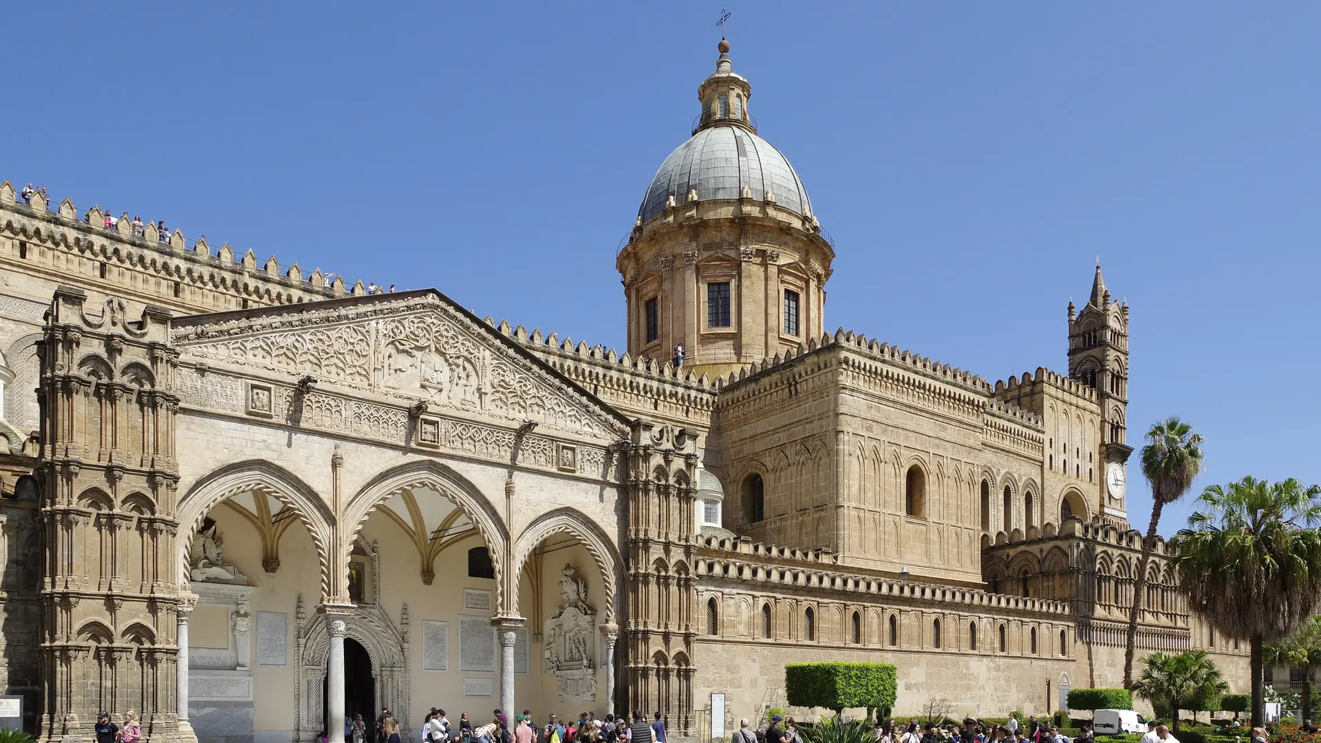 A bright wide view of Palermo rooftops, domes, mountains and the Mediterranean light