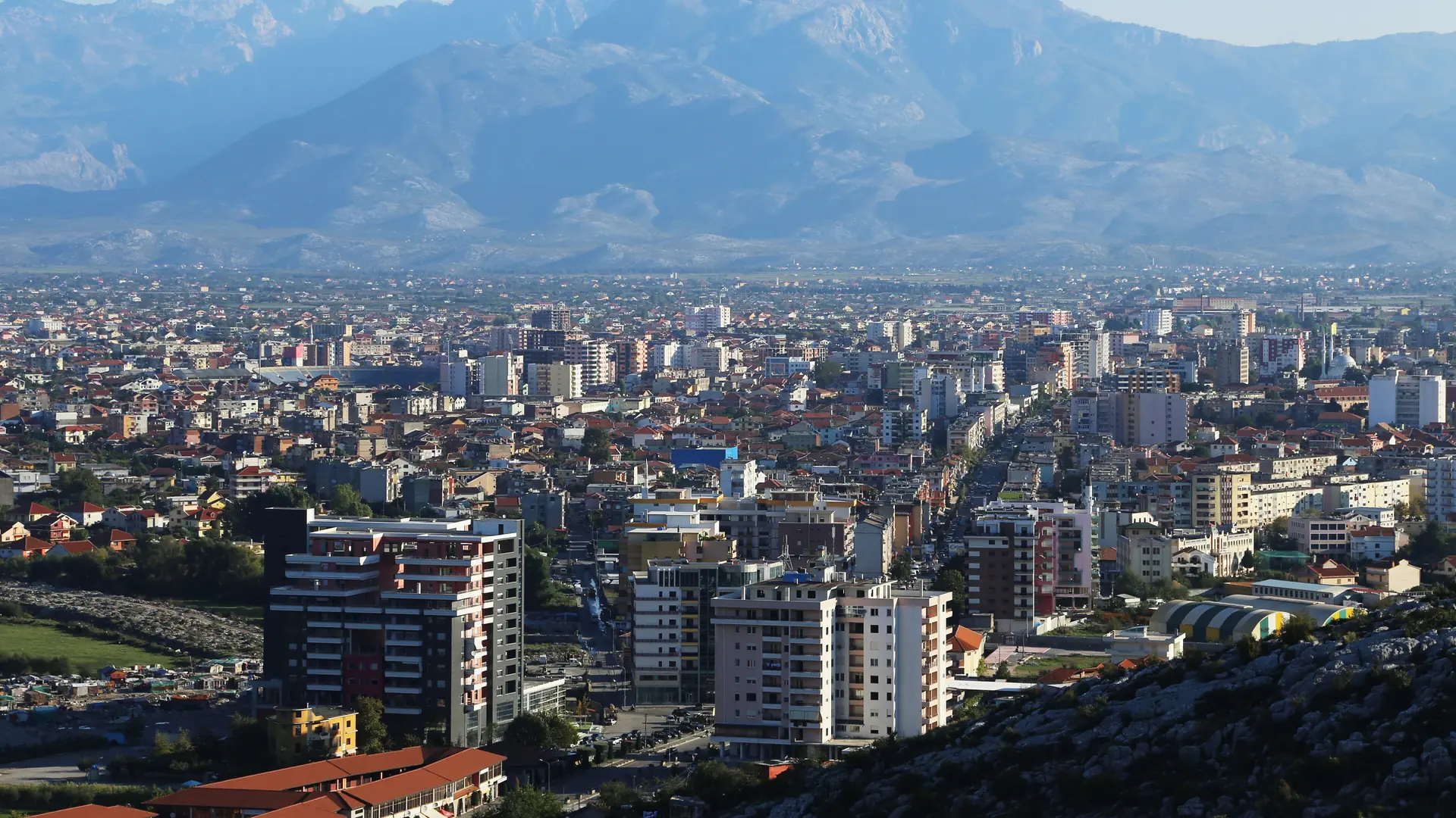 Shkodër spread below the northern mountains, seen from Rozafa Castle on a clear day