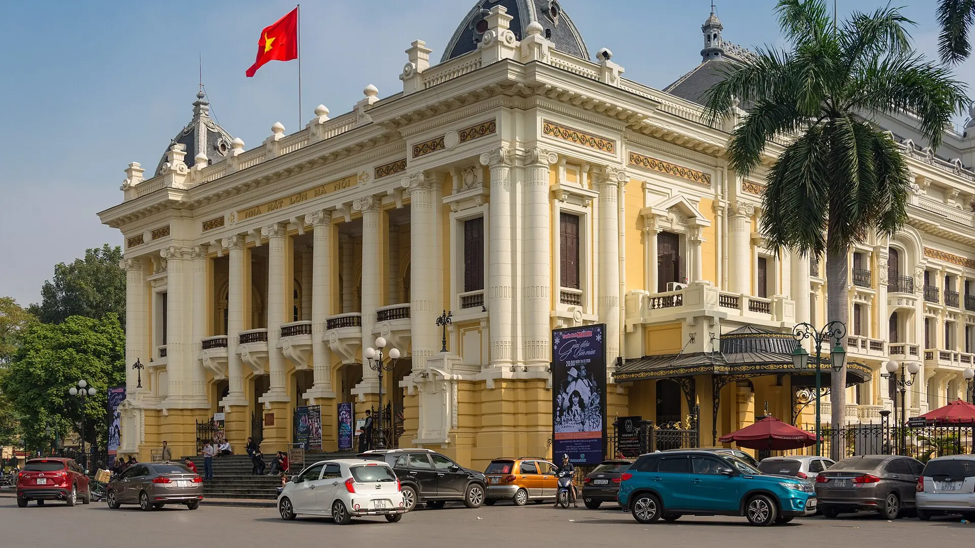 Hanoi Opera House facade with its red national flag
