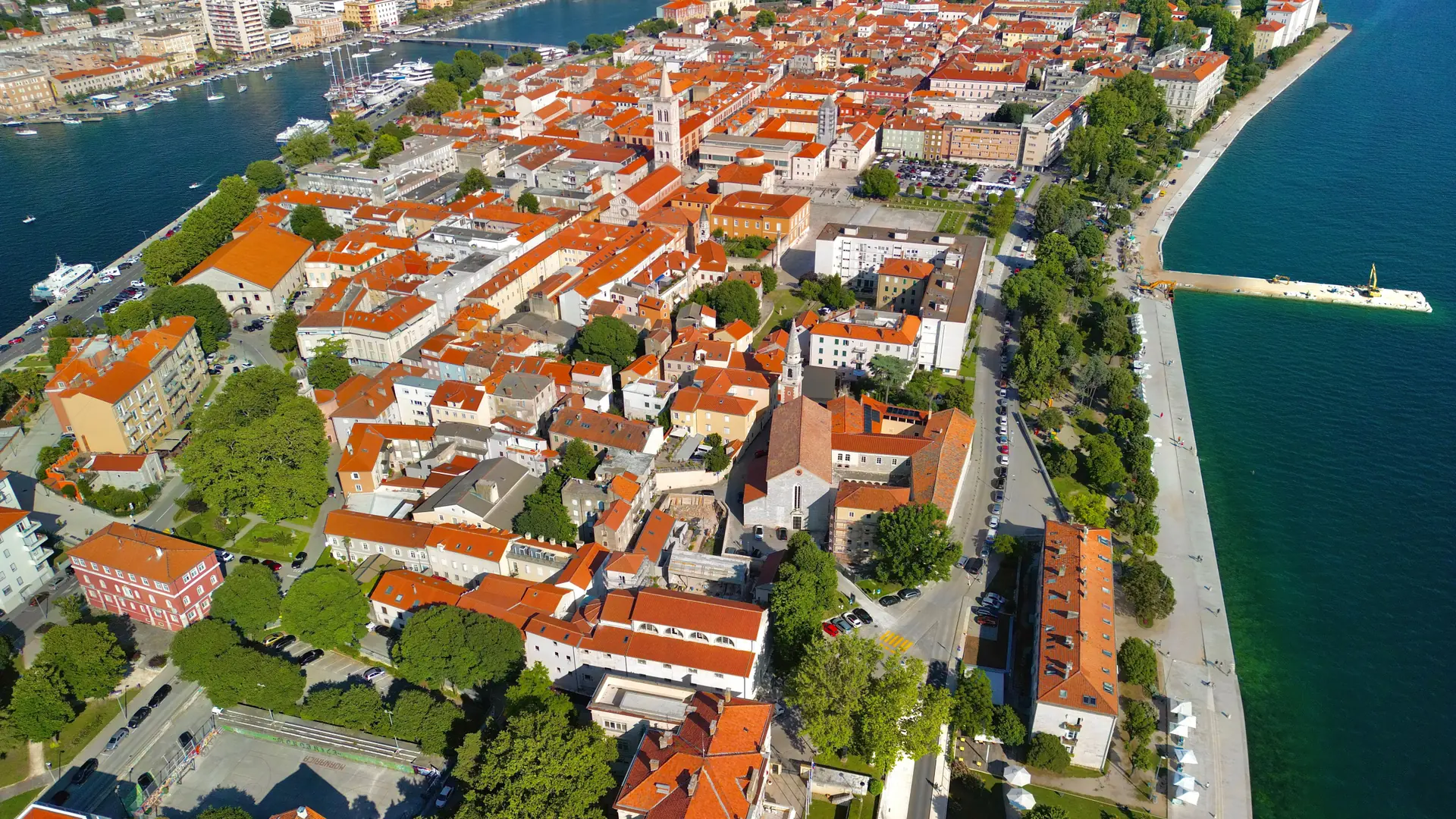 An aerial view of Zadar's old town peninsula with the eastern seafront and promenade