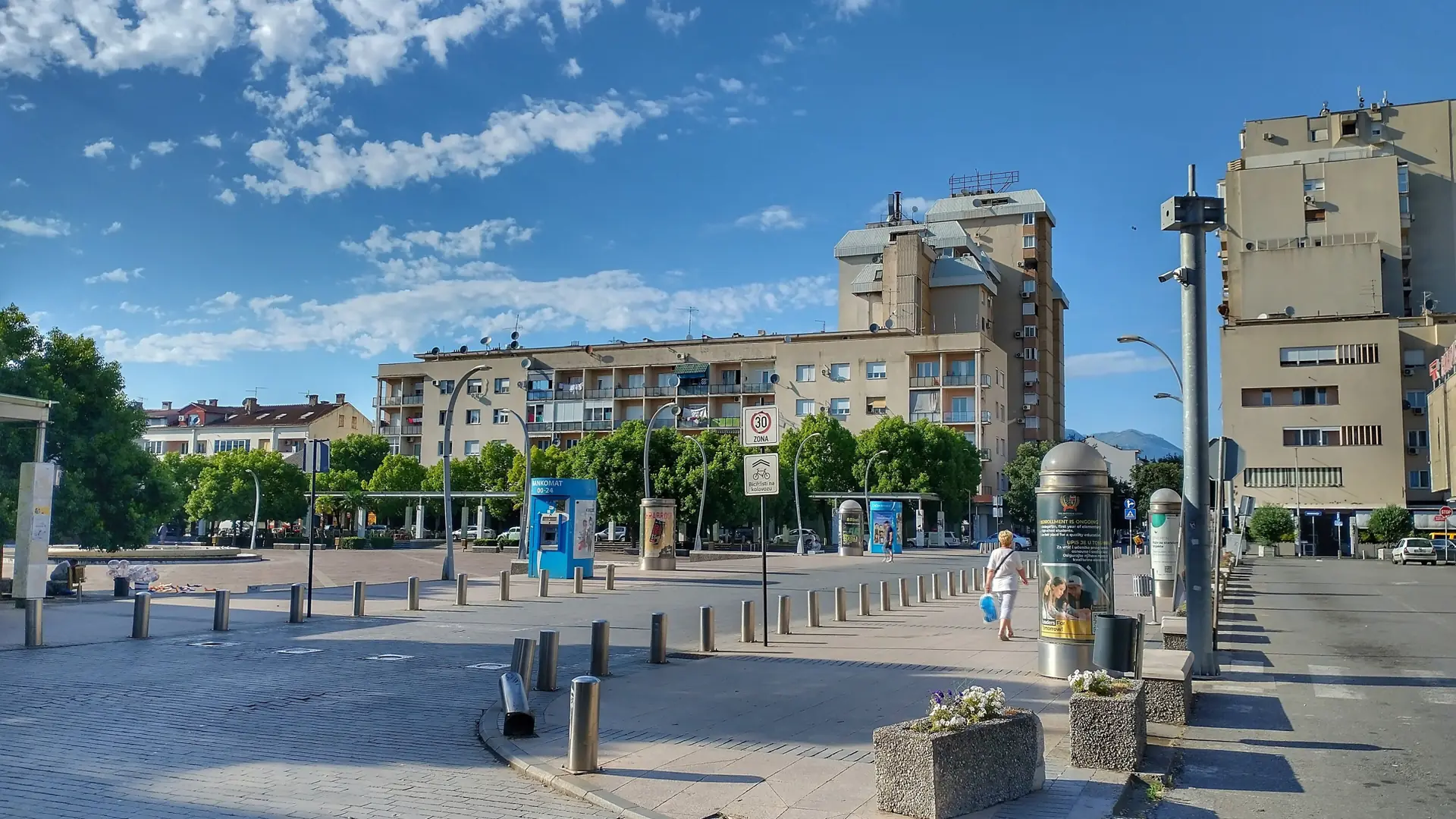 Podgorica Independence Square and its surrounding buildings beneath a blue sky