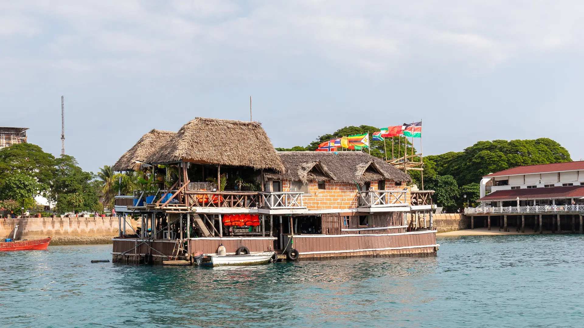 Harbour boats and waterfront buildings in Stone Town, Zanzibar, in daylight