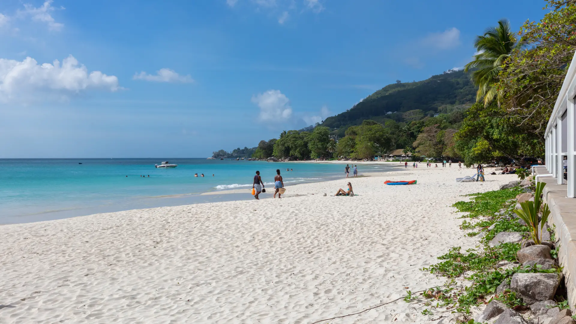 White sand, palms and turquoise Beau Vallon bay on Mahé