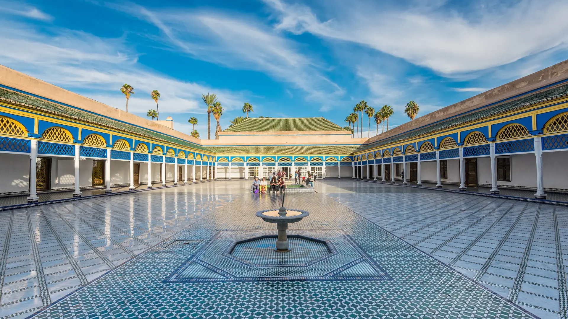Sunlit tiled courtyard and fountain at Bahia Palace beside Marrakech’s Mellah