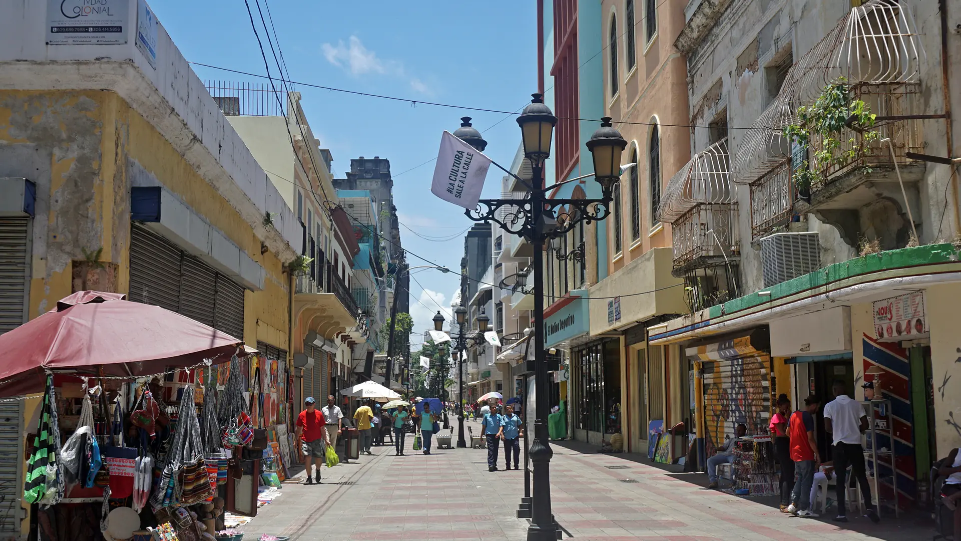 Sunny Calle El Conde pedestrian street and shops in Santo Domingo Colonial City
