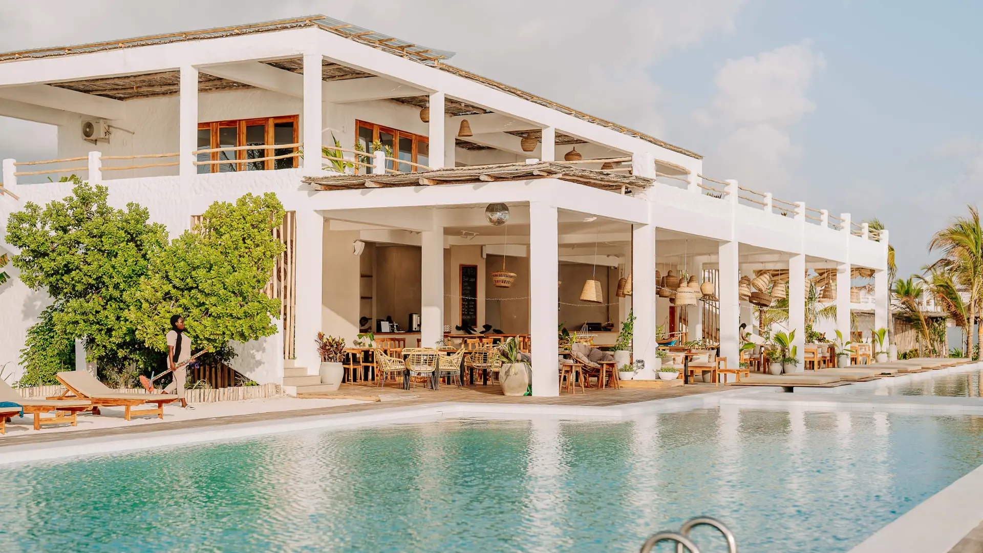 Bright hotel pool and open-air lounge in Jambiani, Zanzibar