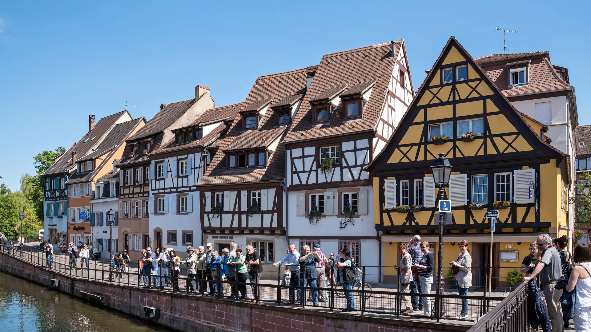 Colourful half-timbered houses beside the Lauch at Quai de la Poissonnerie in Colmar