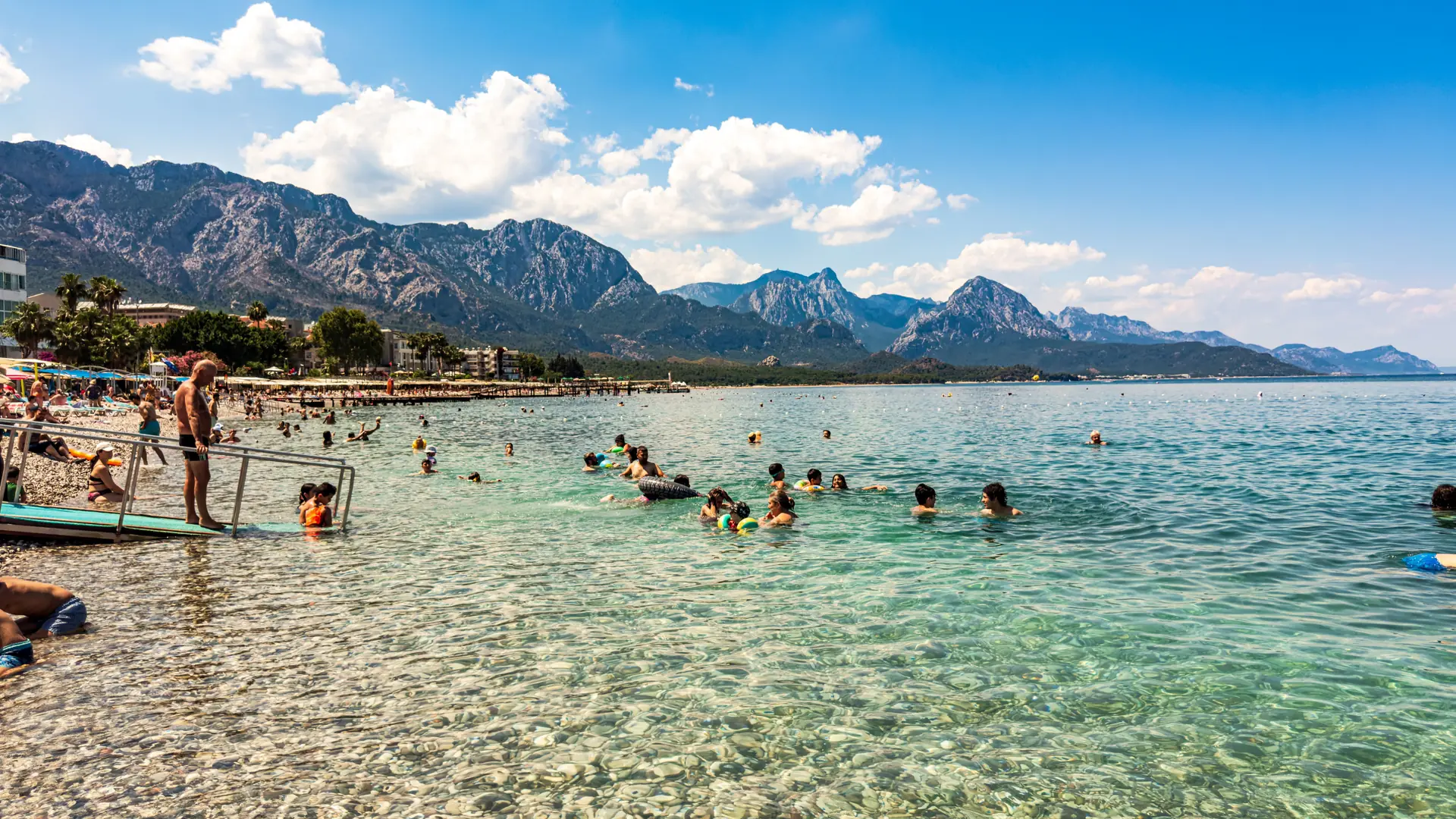 Bright Konyaalti Beach with turquoise water and mountains west of Antalya