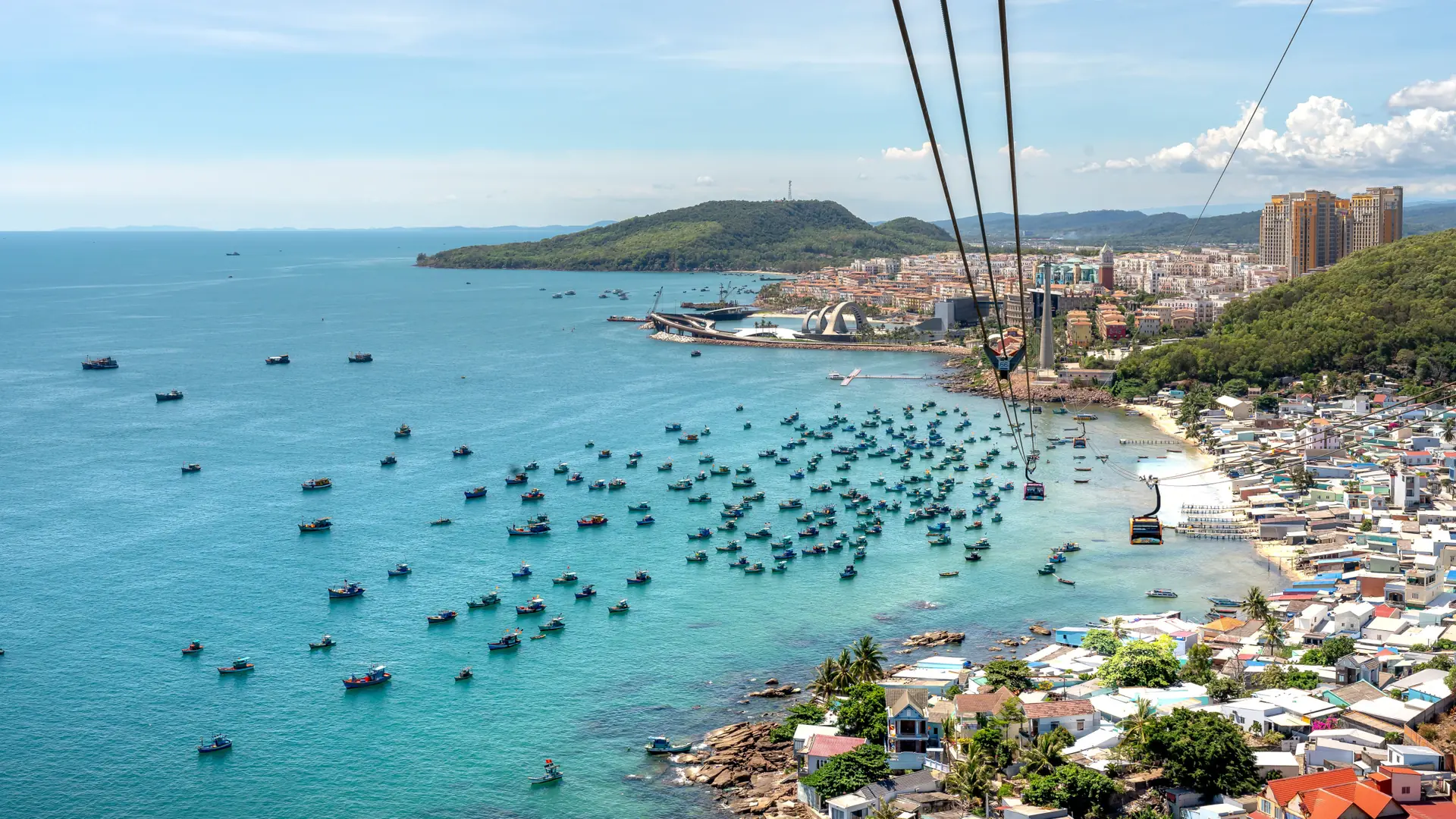 An Thoi fishing boats and blue coastal water seen from the Hon Thom cable journey