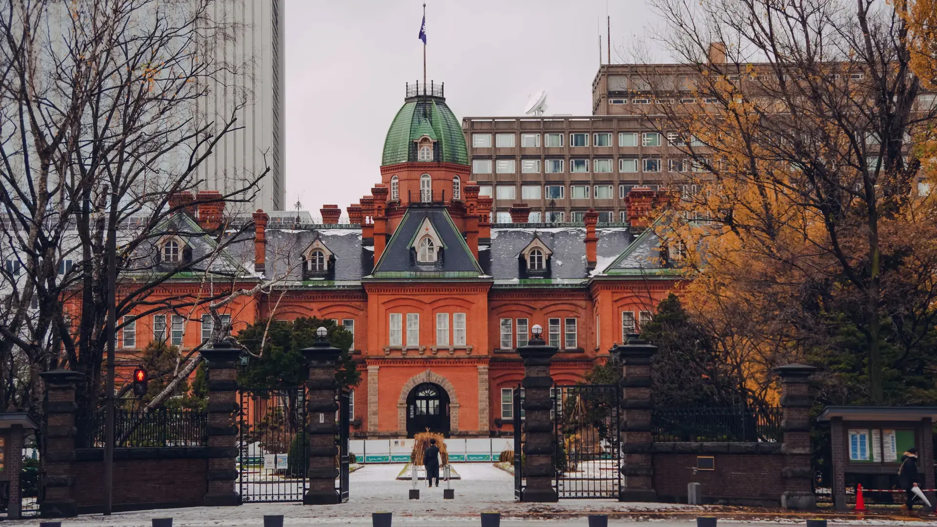red-brick former Hokkaido Government Office near Sapporo Station framed by winter trees
