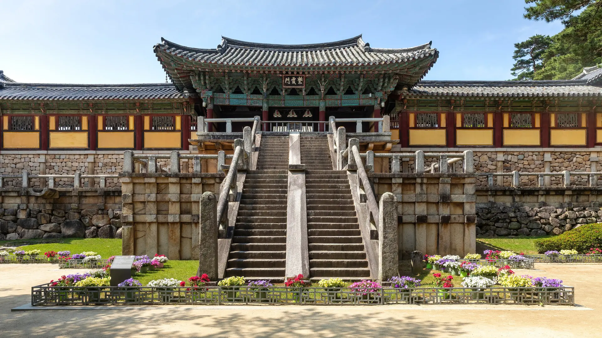 Bulguksa’s broad stone stairways rising to a painted wooden pavilion and tiled-roof halls in Gyeongju