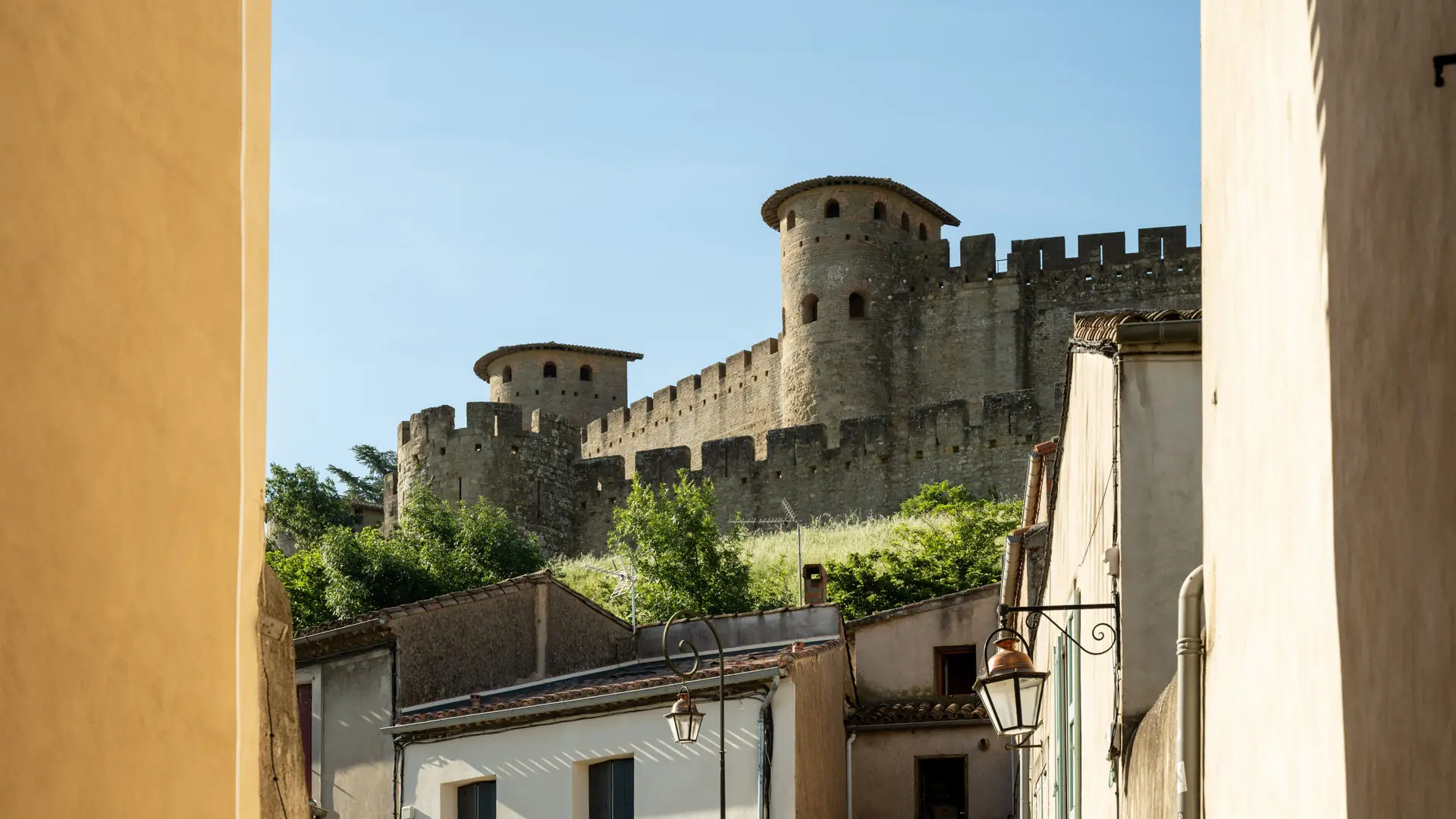 Carcassonne’s fortified walls seen above houses at the foot of the medieval city